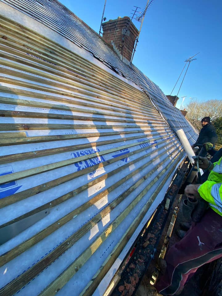 Professional roofers working on a property in London - KS Roof Master