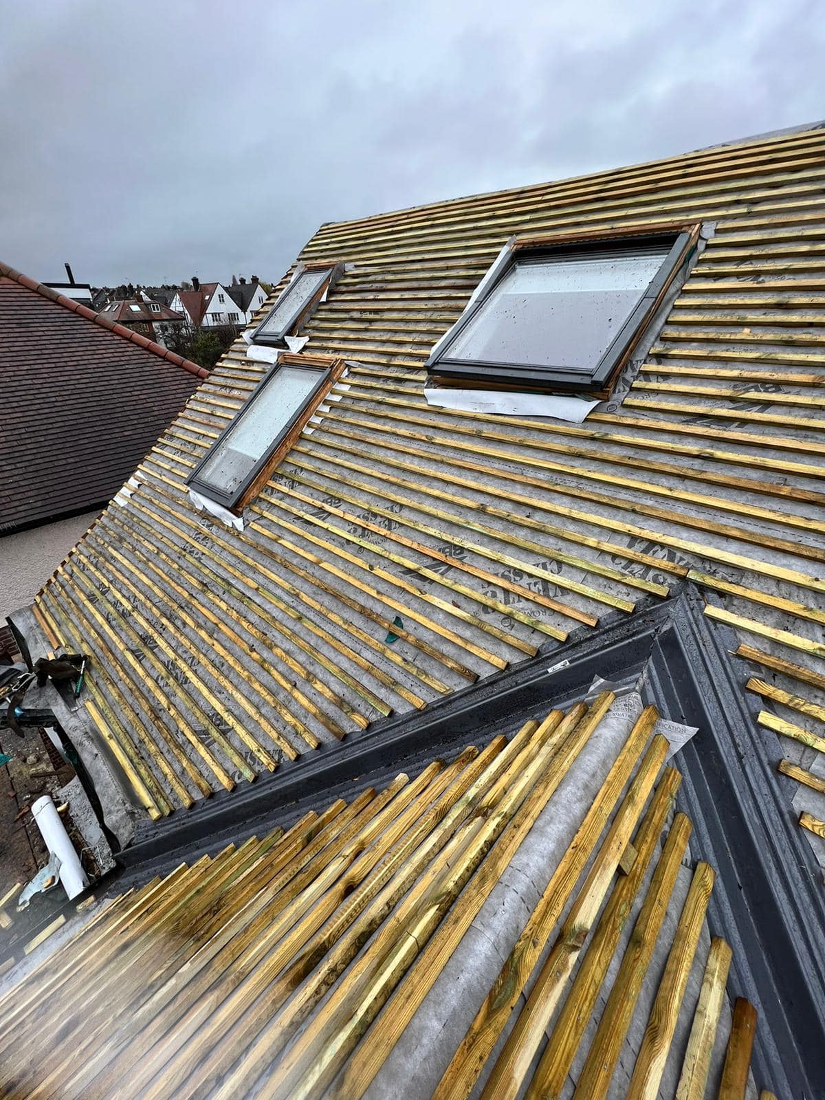 Professional roofers working on a property in London - KS Roof Master
