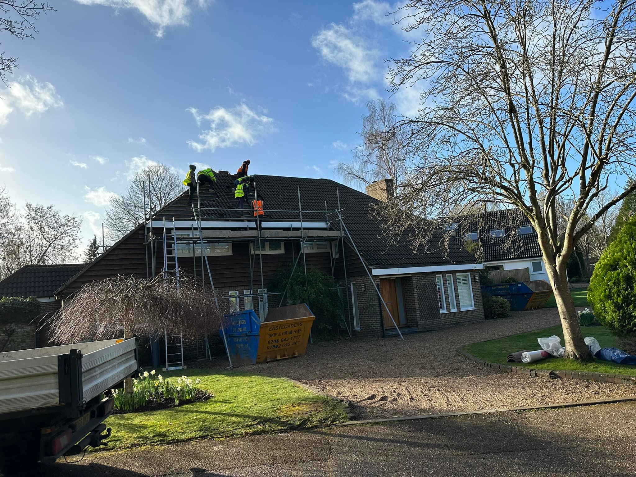 Professional roofers working on a property in London - KS Roof Master