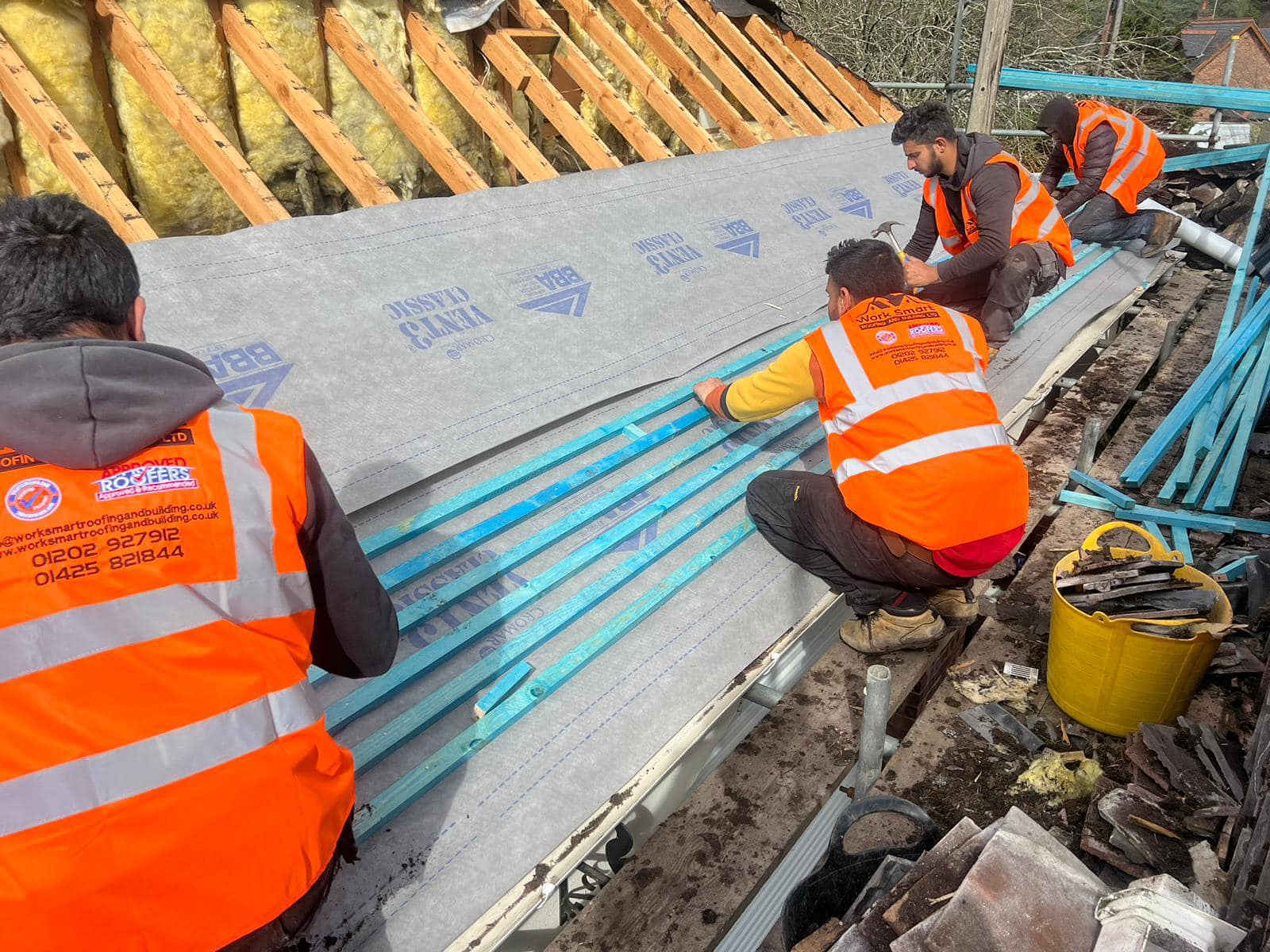 Professional roofers working on a property in London - KS Roof Master