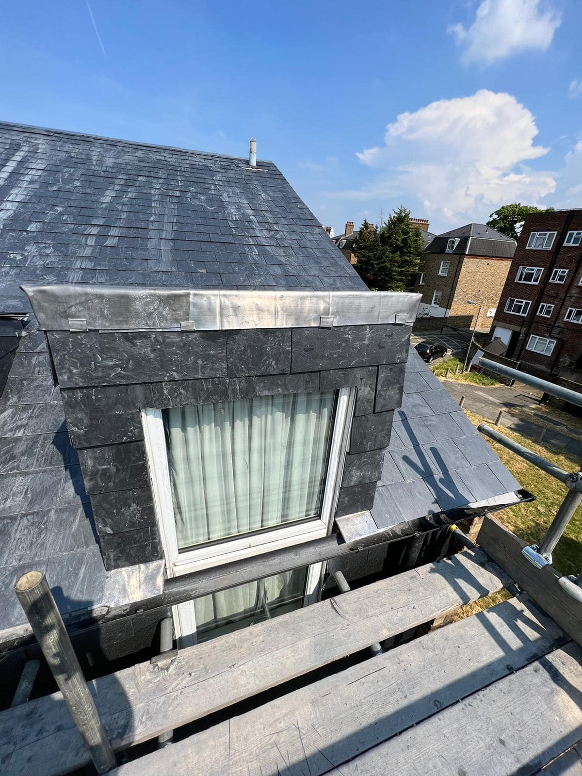 Professional roofers working on a property in London - KS Roof Master