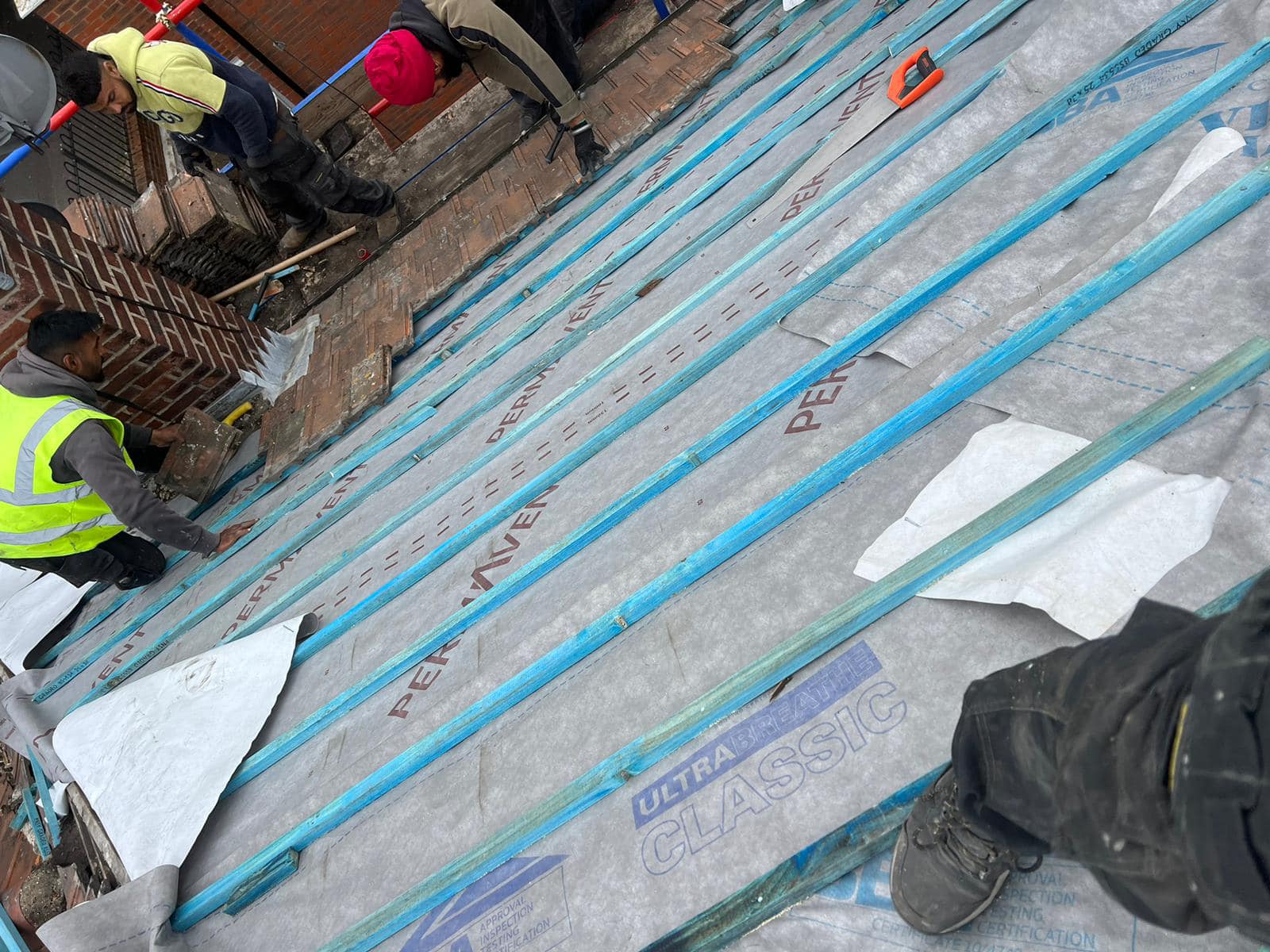 Professional roofers working on a property in London - KS Roof Master