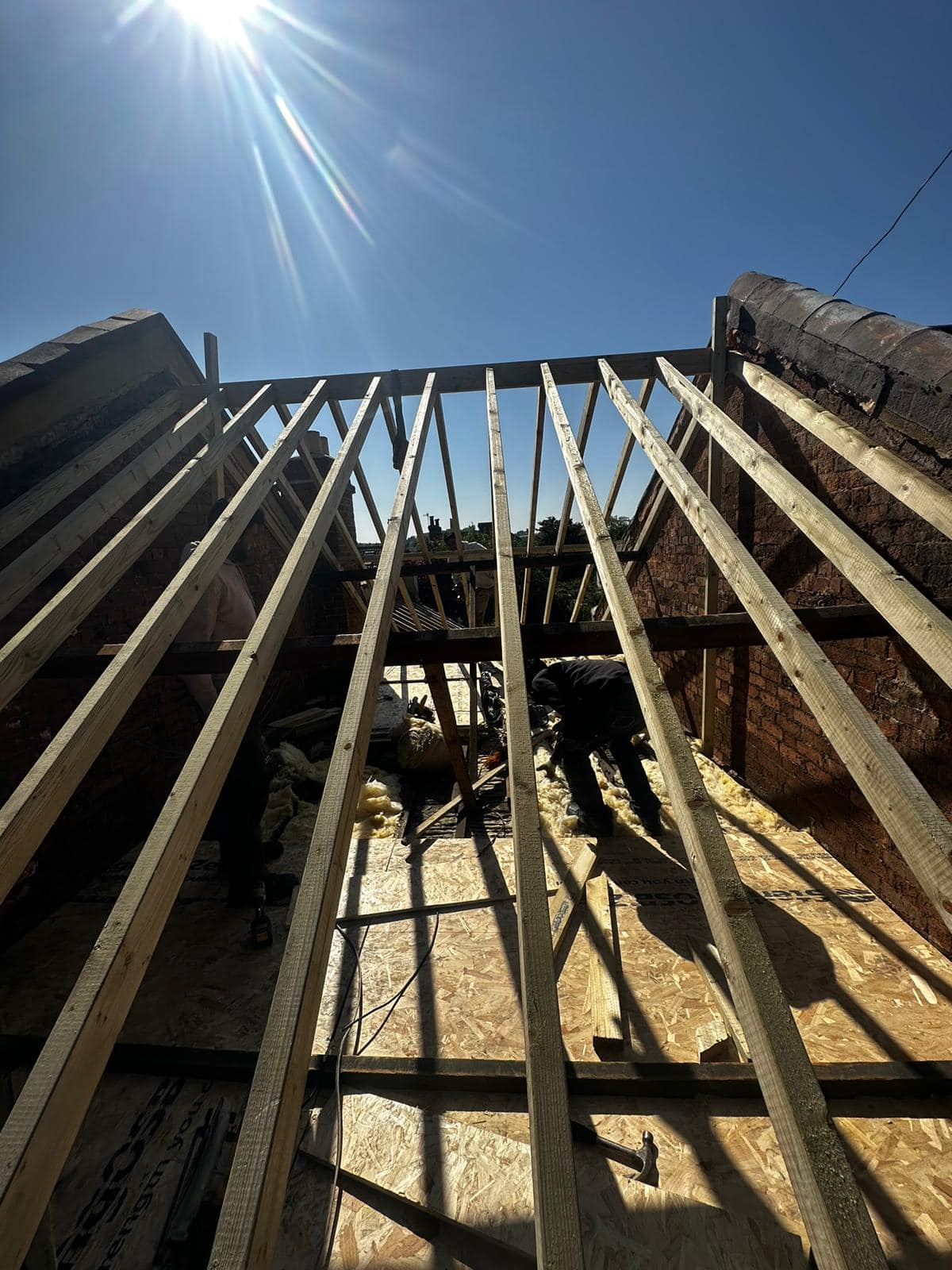 Professional roofers working on a property in London - KS Roof Master