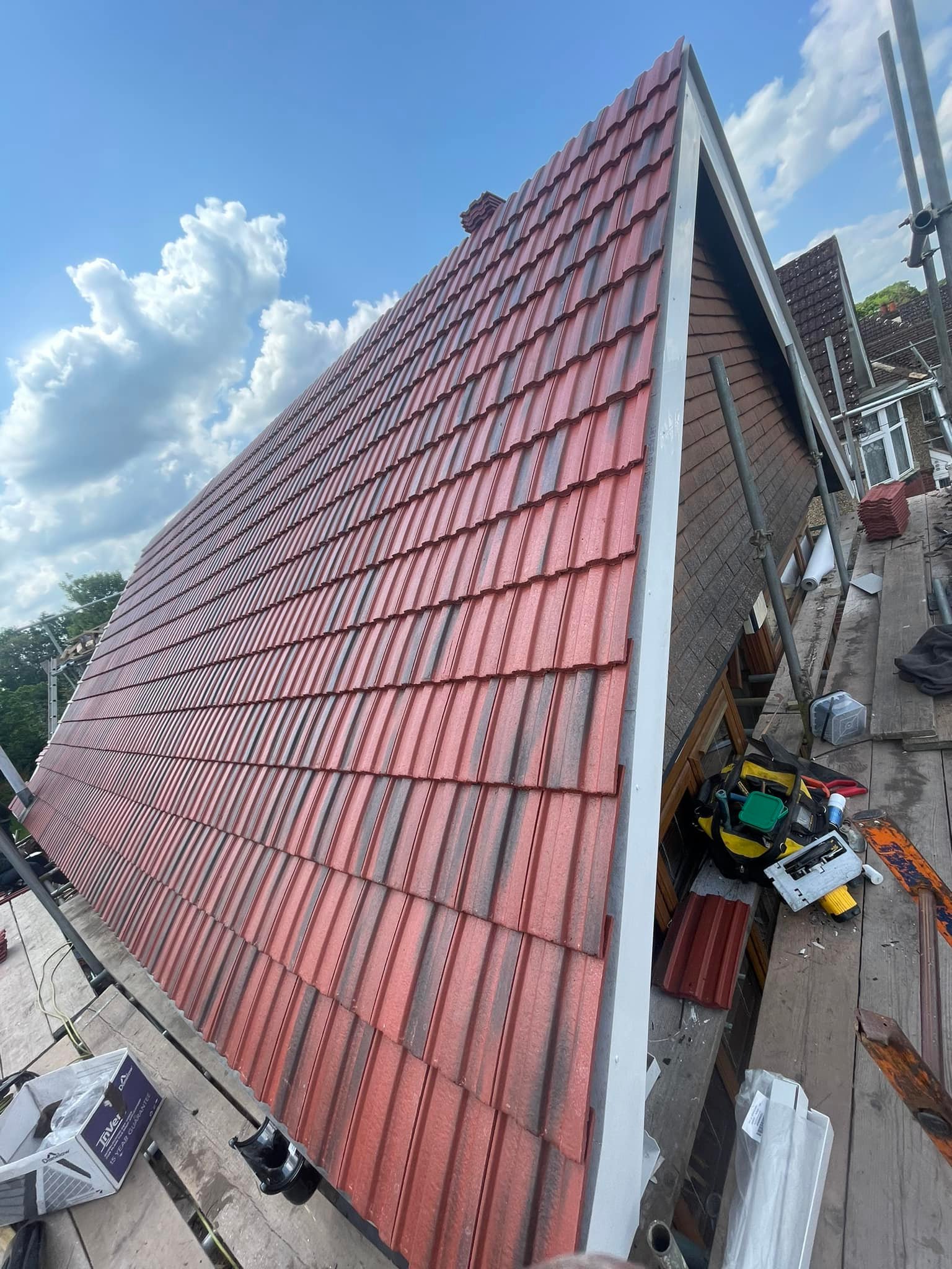 Professional roofers working on a property in London - KS Roof Master