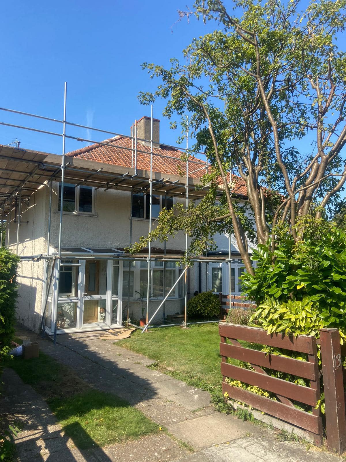 Professional roofers working on a property in London - KS Roof Master