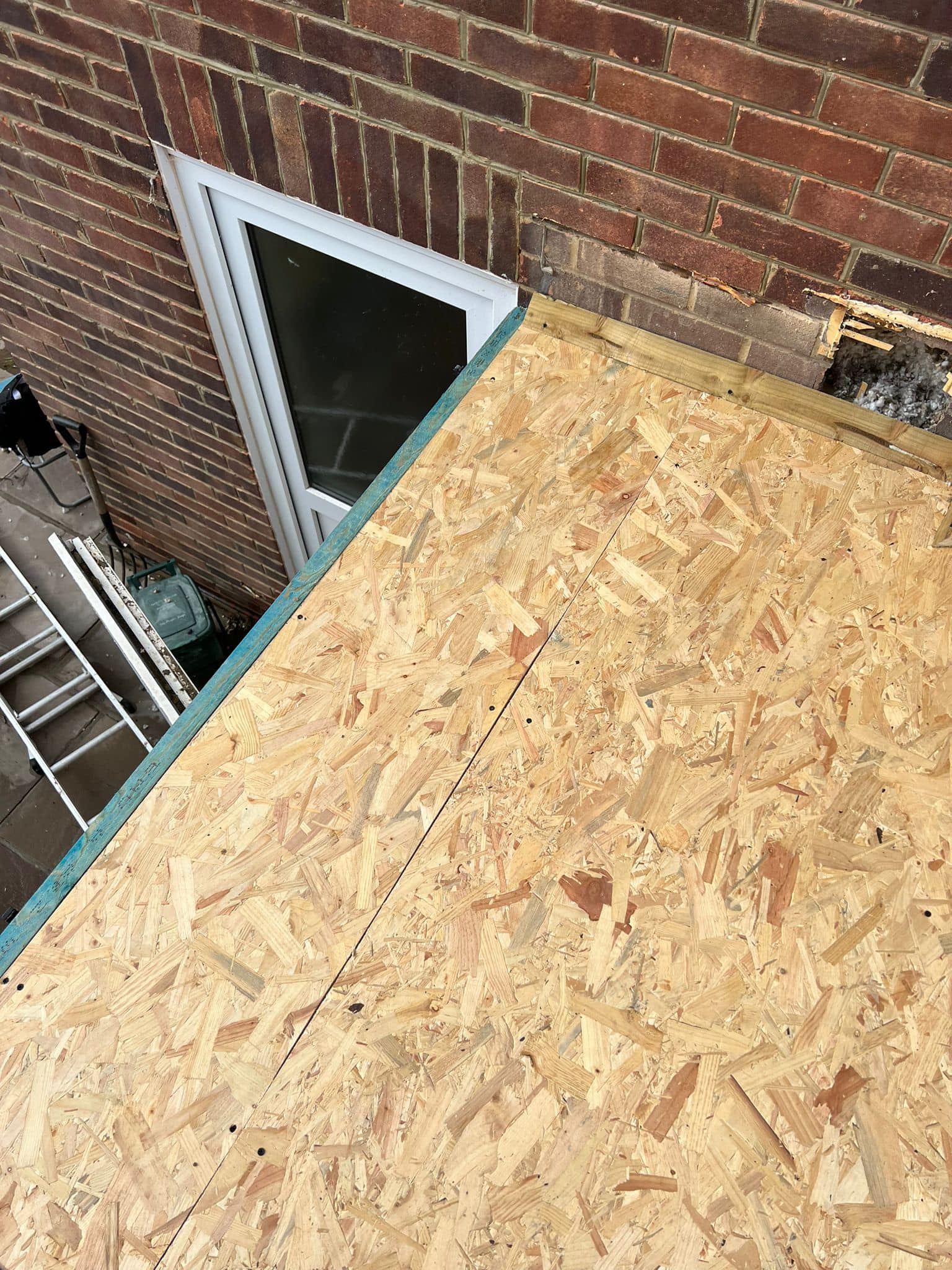 Professional roofers working on a property in London - KS Roof Master