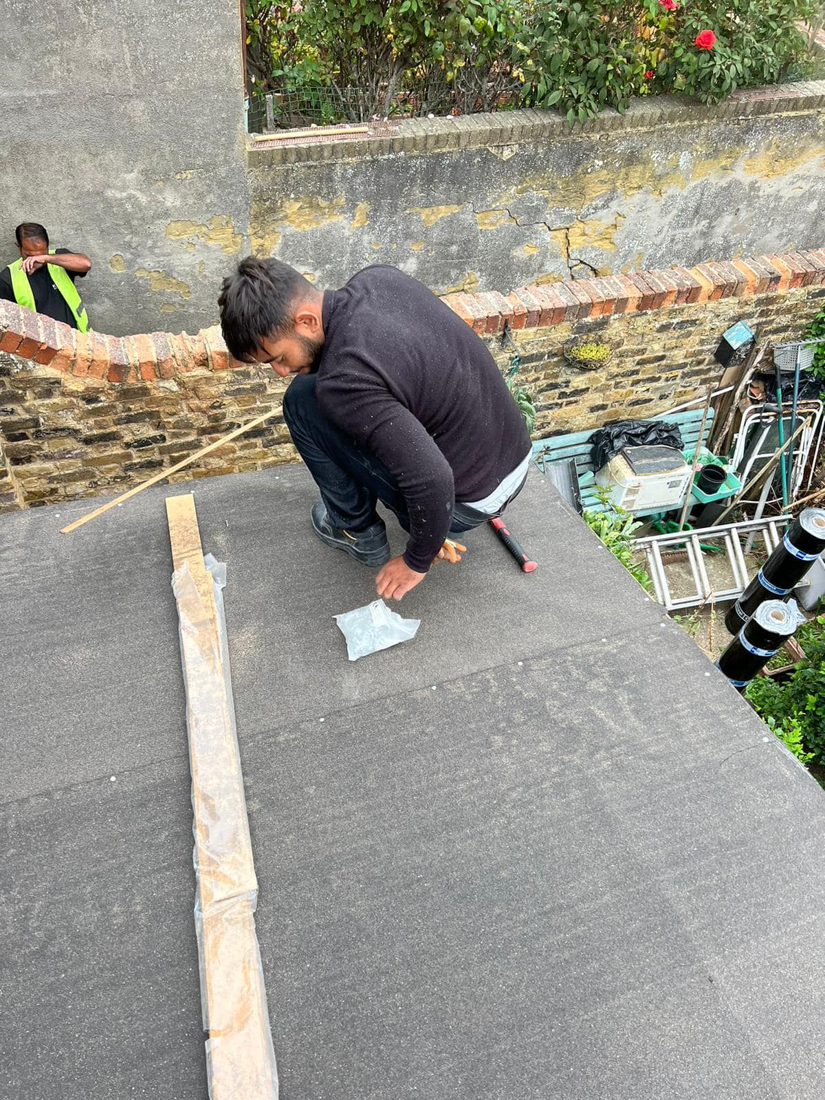 Professional roofers working on a property in London - KS Roof Master