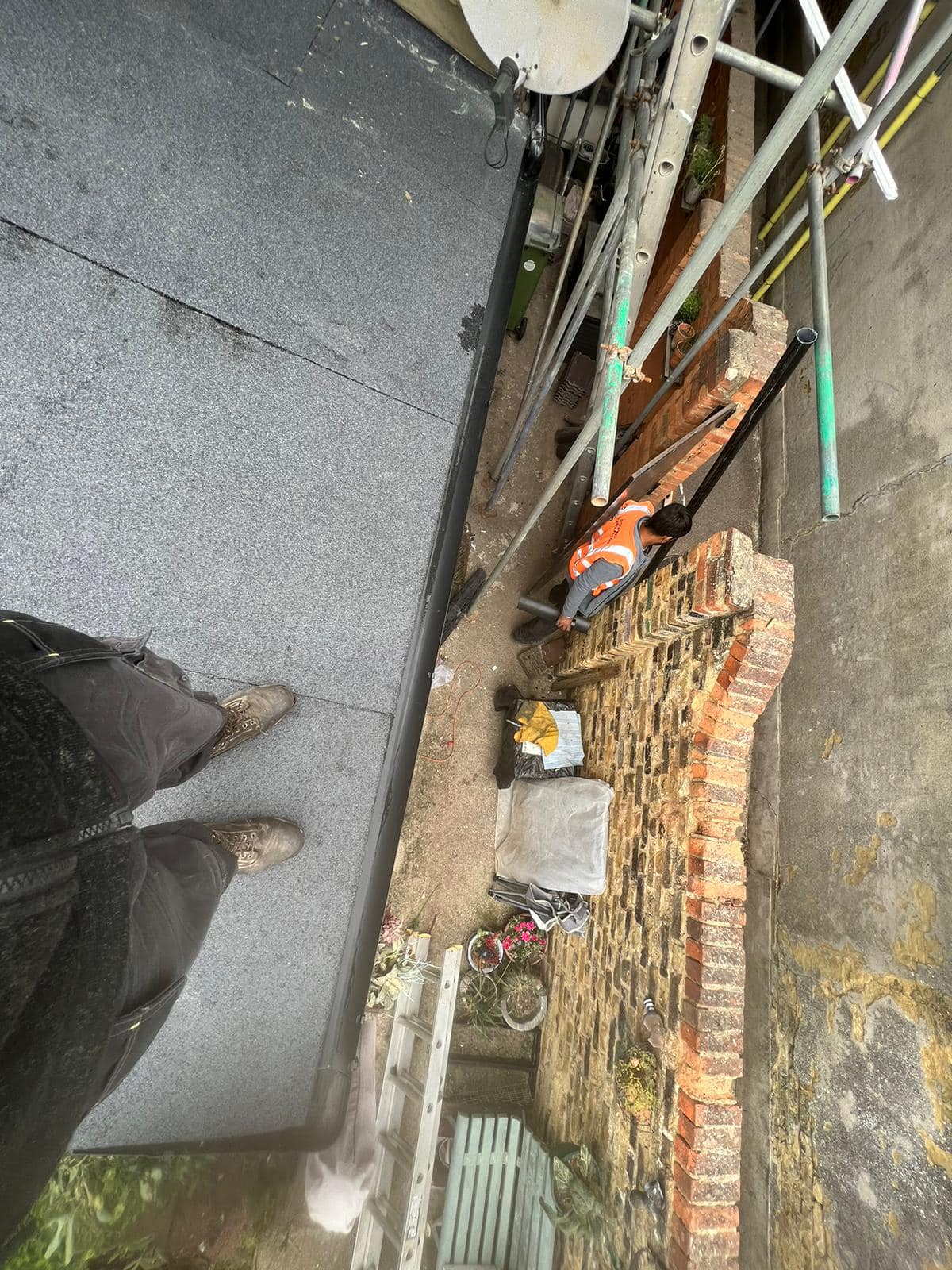 Professional roofers working on a property in London - KS Roof Master