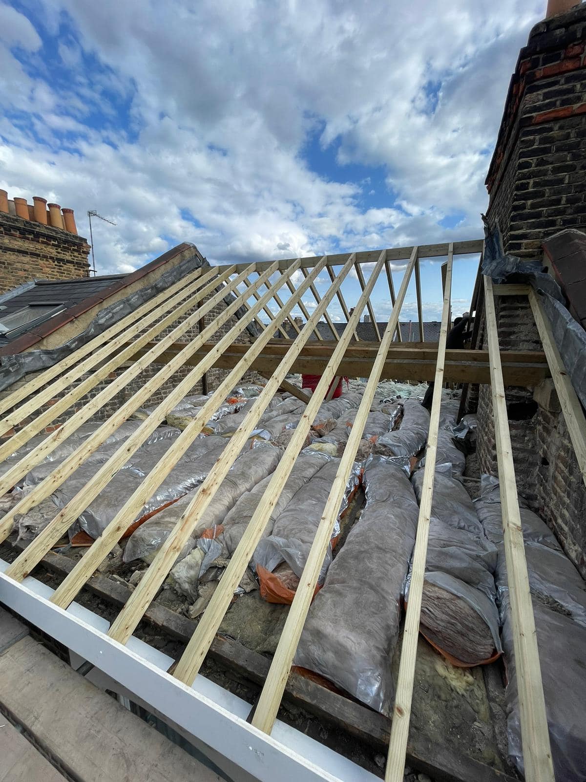 Professional roofers working on a property in London - KS Roof Master