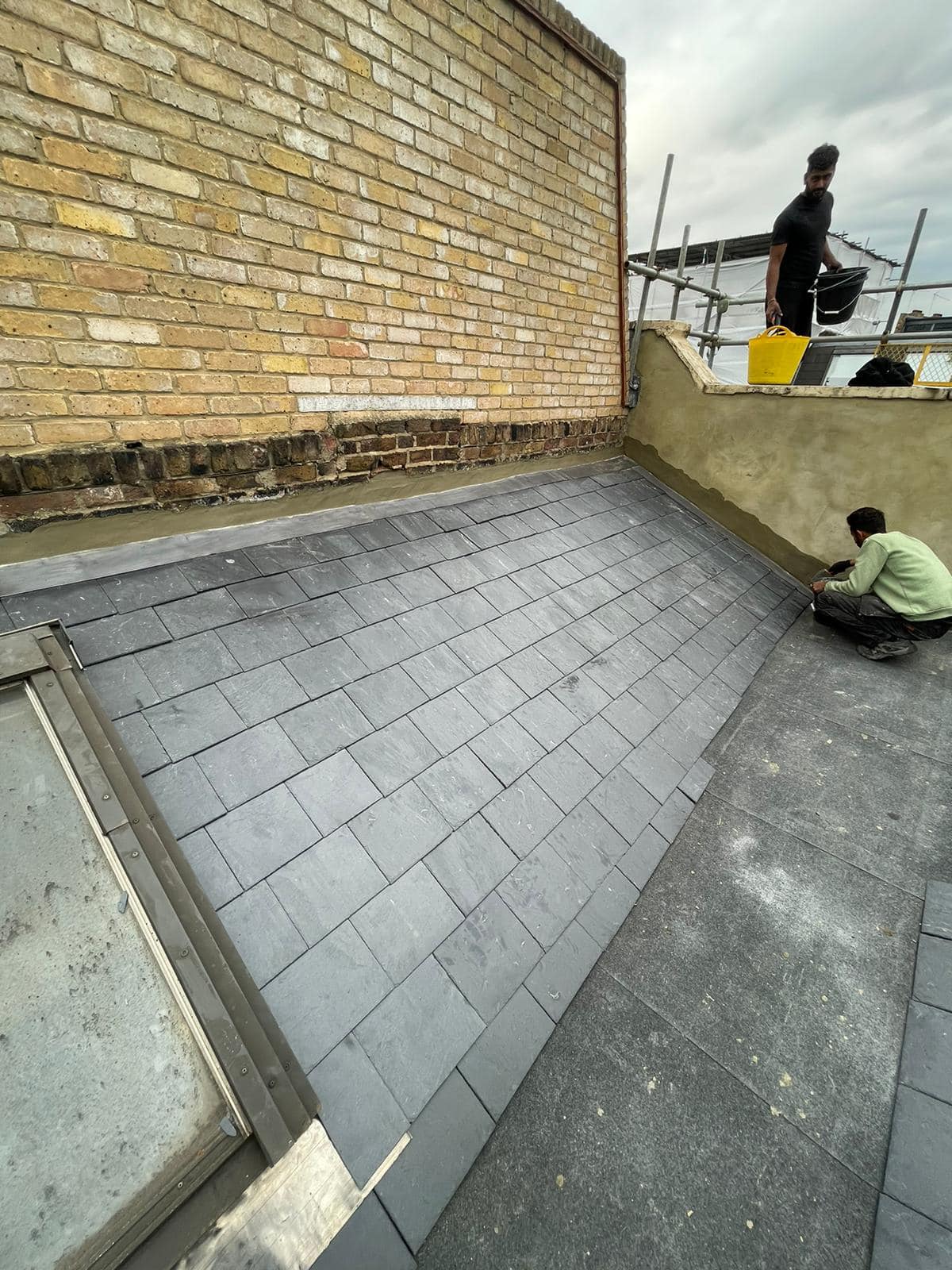 Professional roofers working on a property in London - KS Roof Master