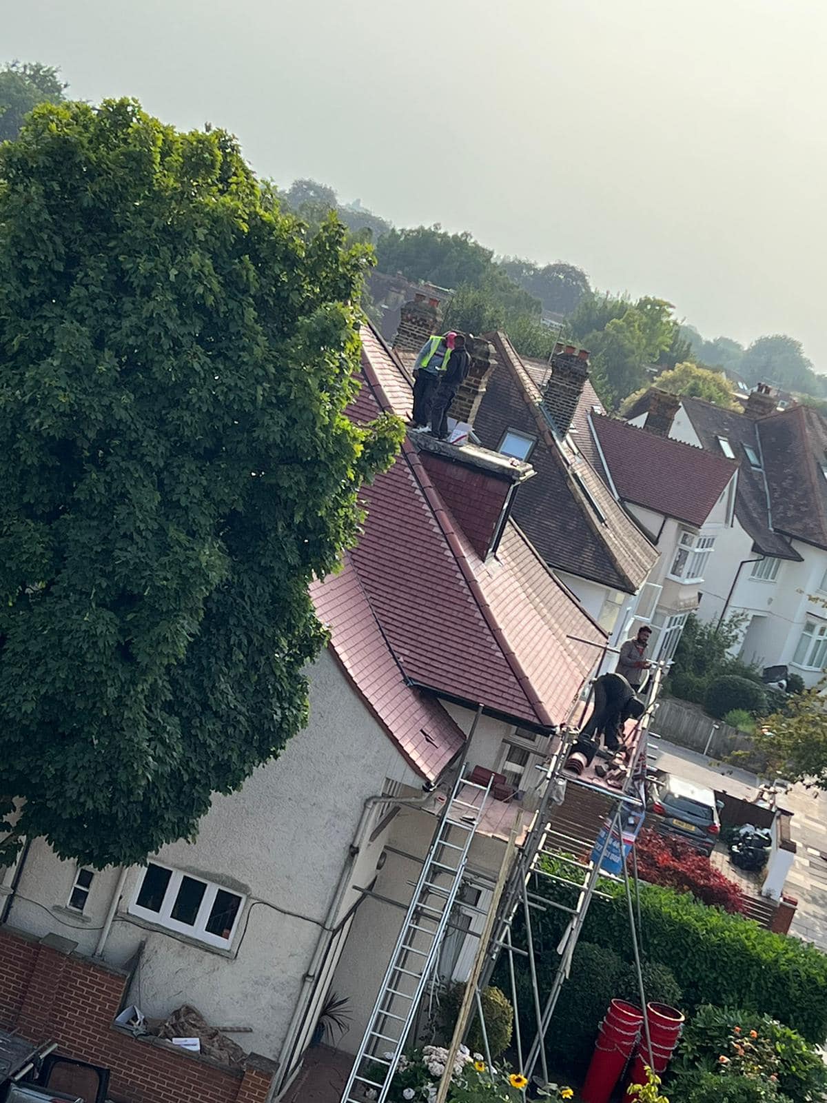 Professional roofers working on a property in London - KS Roof Master