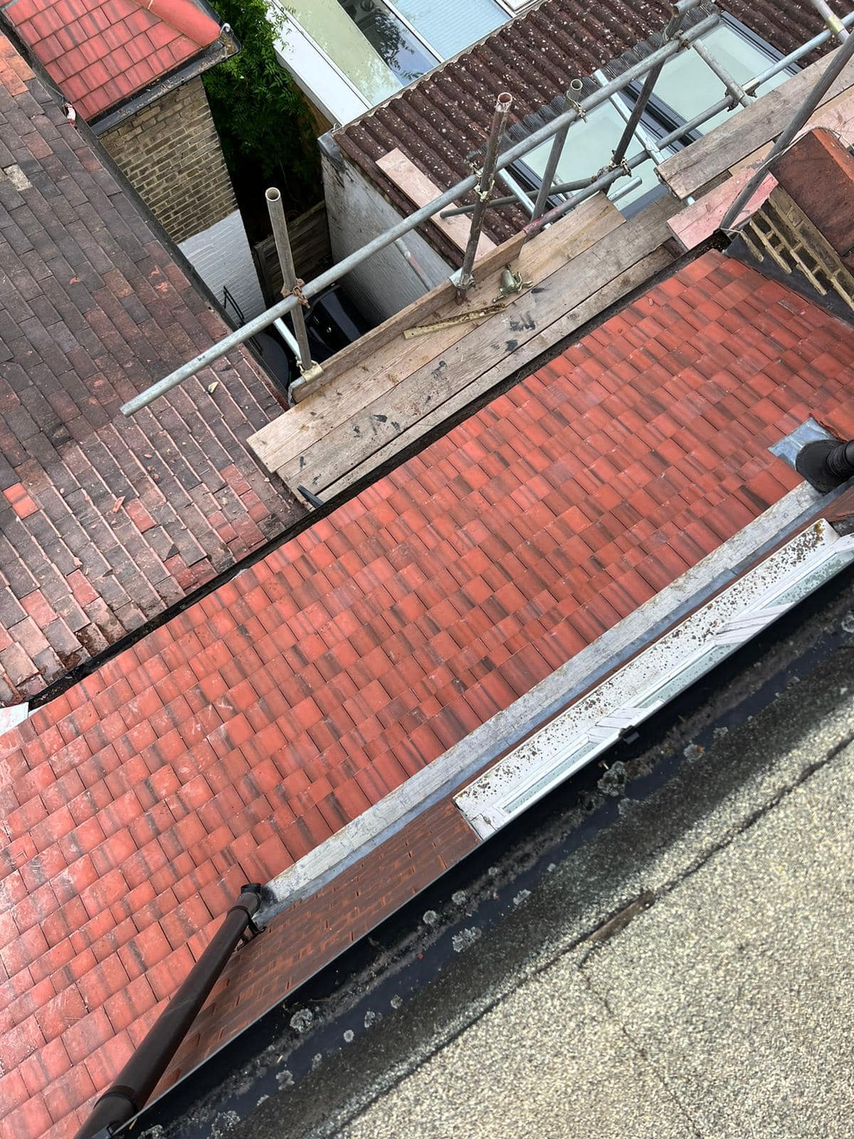 Professional roofers working on a property in London - KS Roof Master