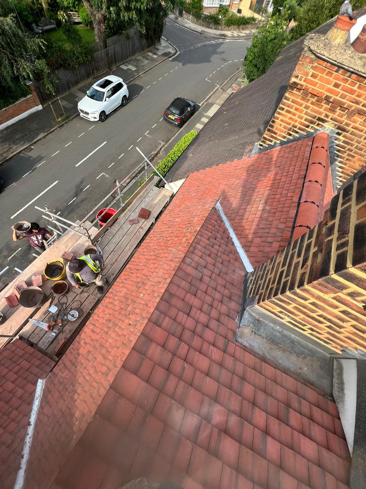 Professional roofers working on a property in London - KS Roof Master