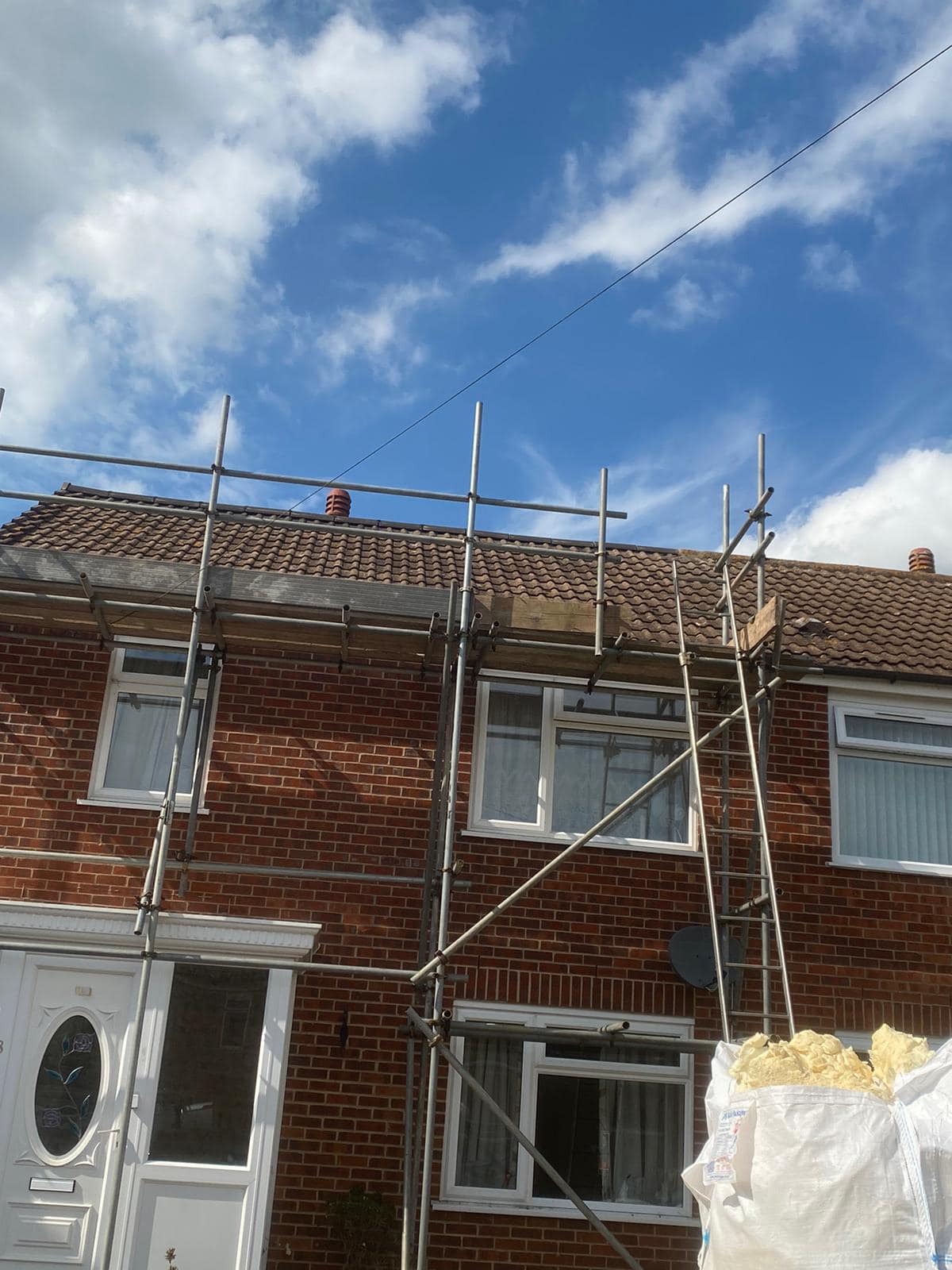 Professional roofers working on a property in London - KS Roof Master