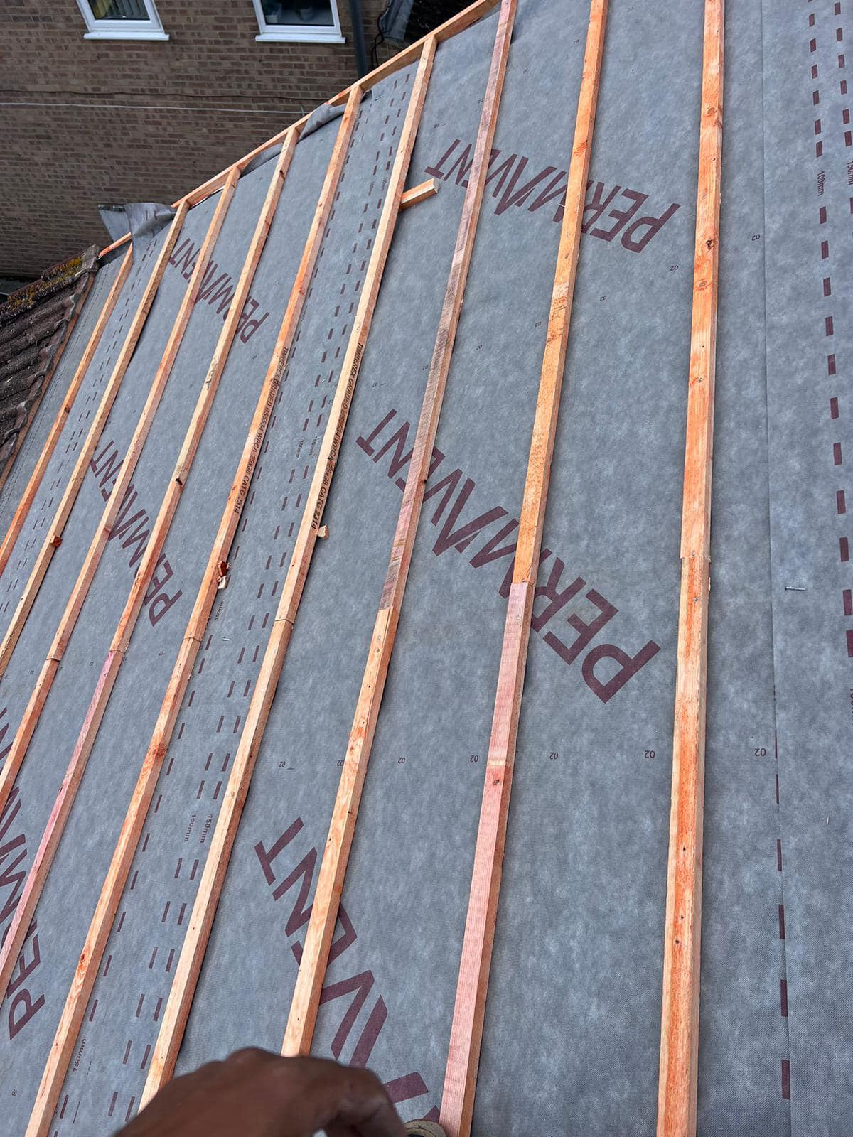Professional roofers working on a property in London - KS Roof Master