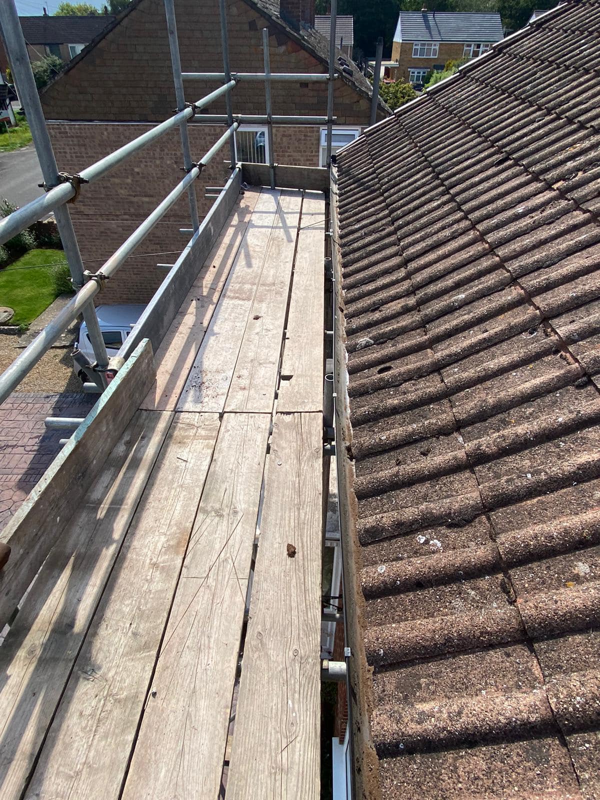 Professional roofers working on a property in London - KS Roof Master