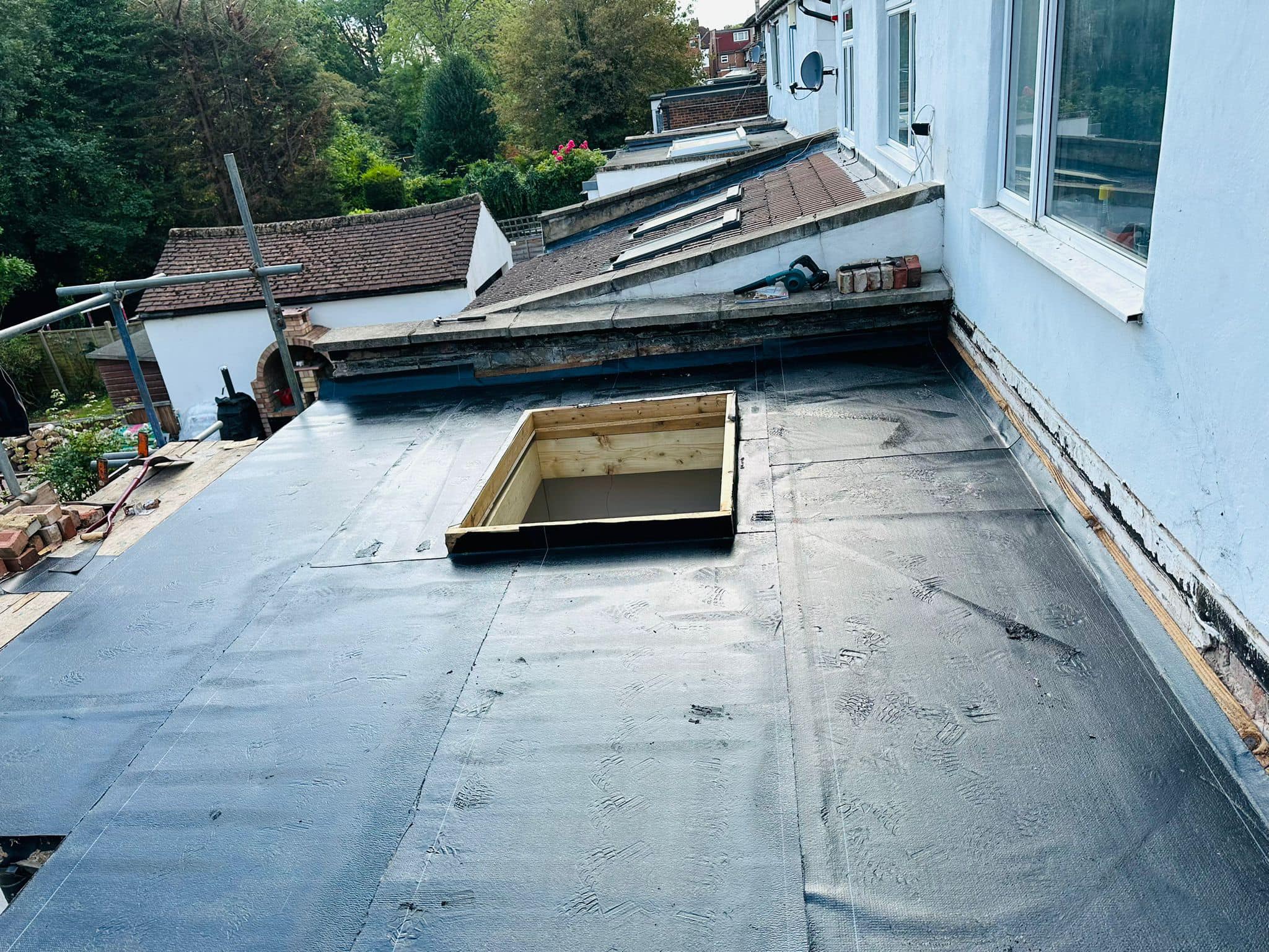 Professional roofers working on a property in London - KS Roof Master