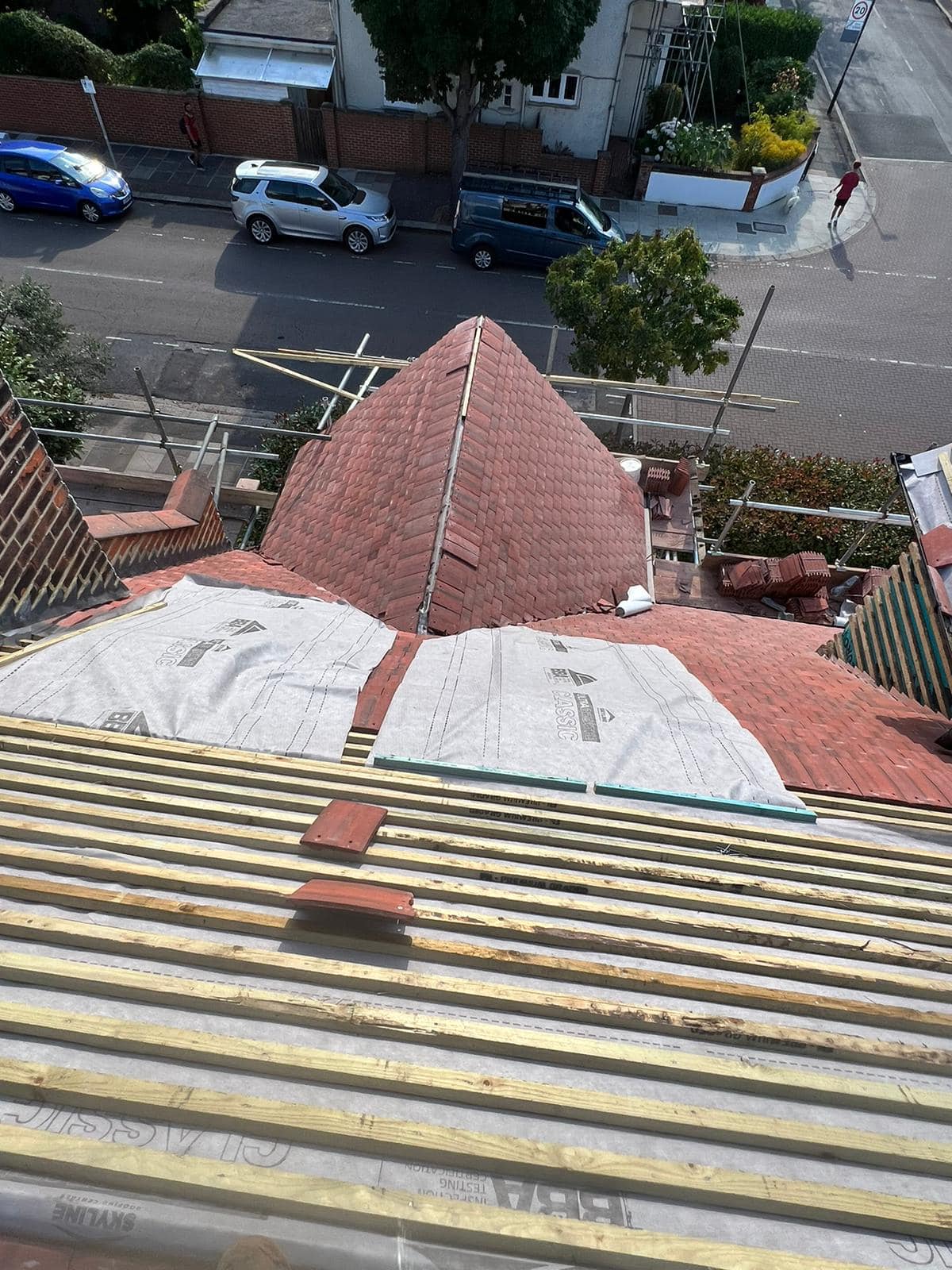 Professional roofers working on a property in London - KS Roof Master