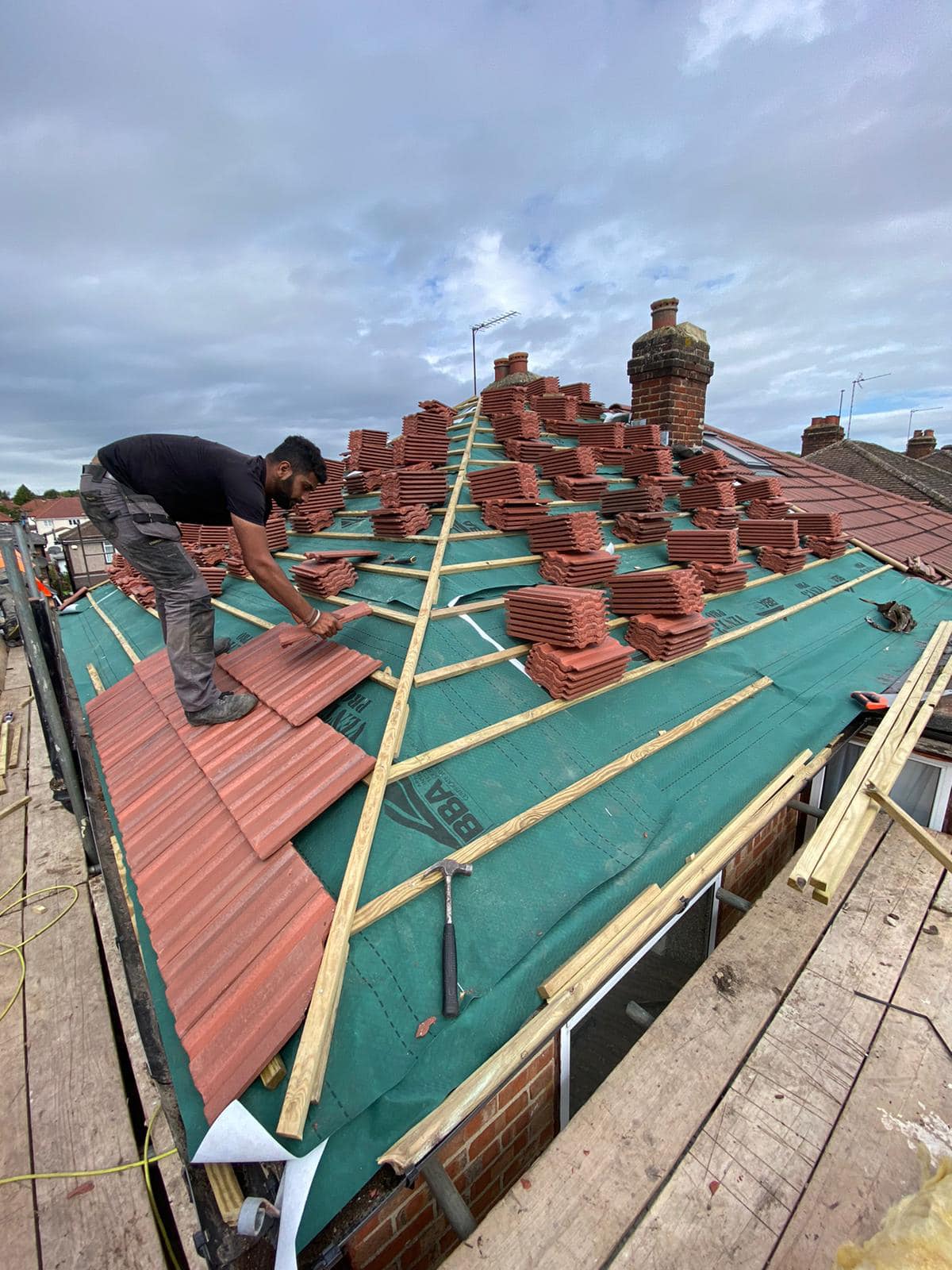 Professional roofers working on a property in London - KS Roof Master