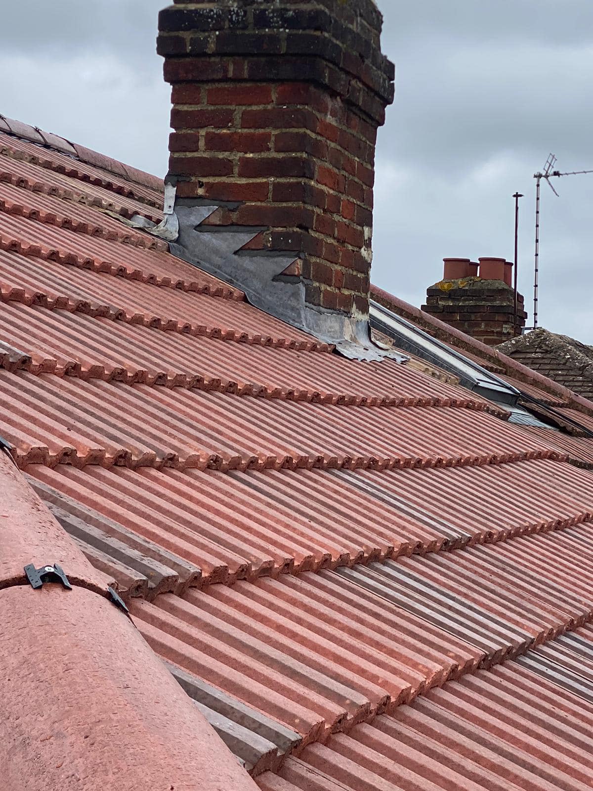 Professional roofers working on a property in London - KS Roof Master