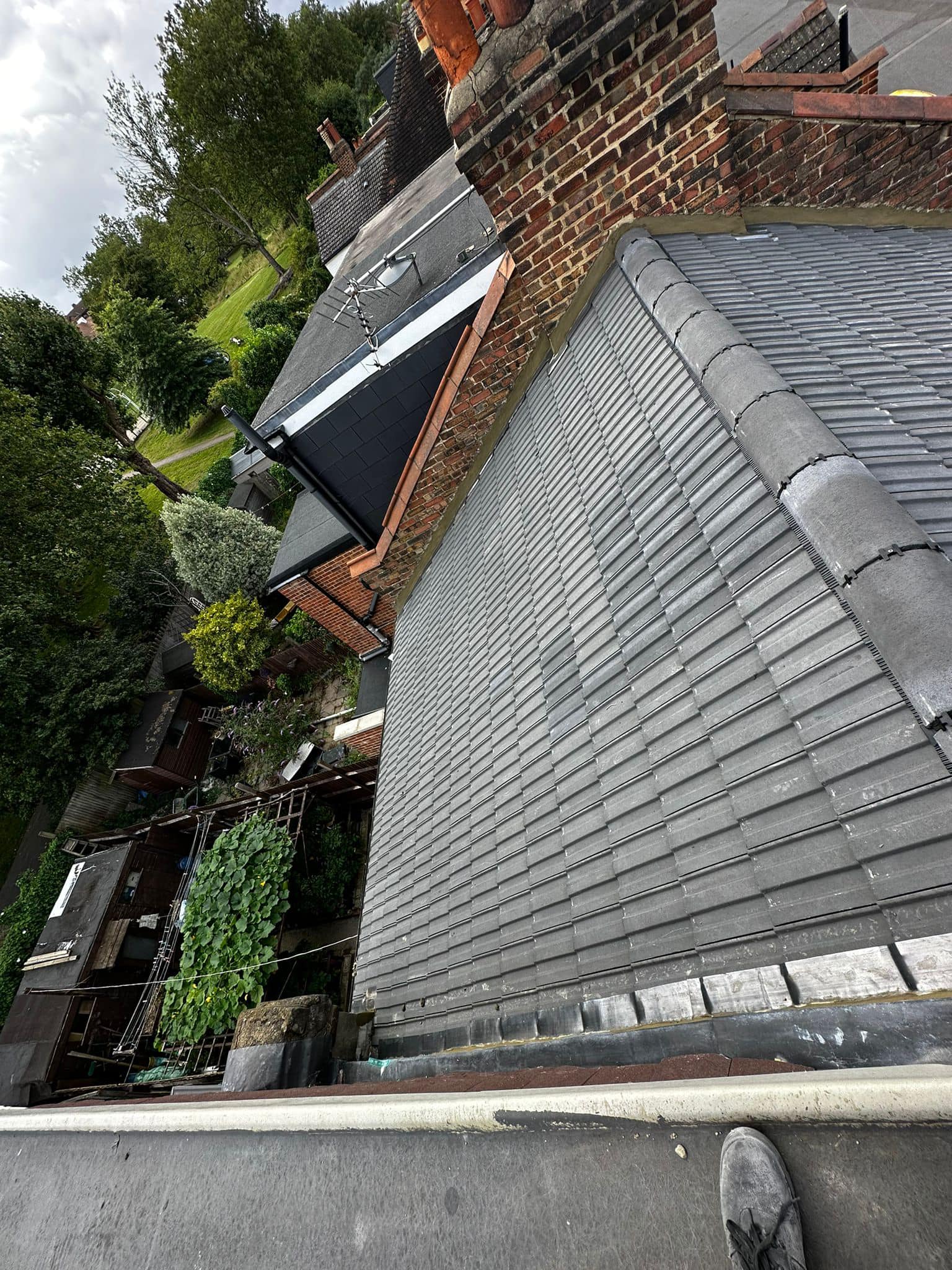Professional roofers working on a property in London - KS Roof Master