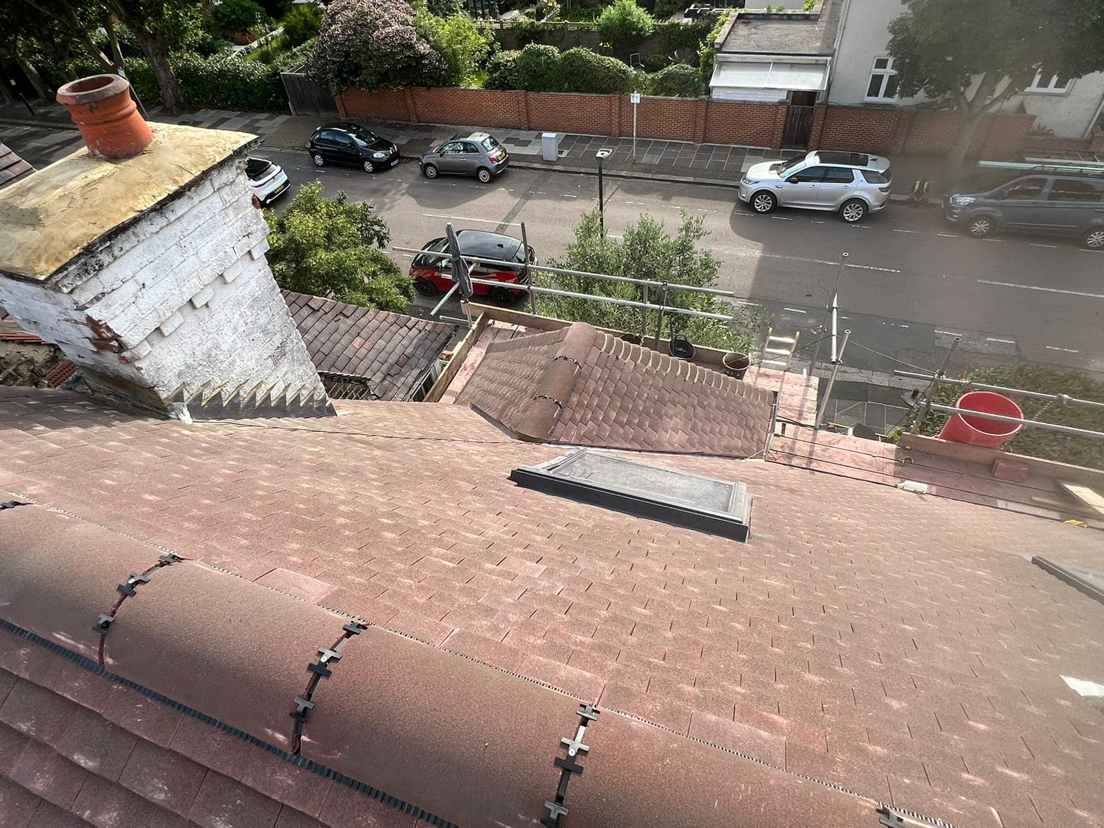 Professional roofers working on a property in London - KS Roof Master