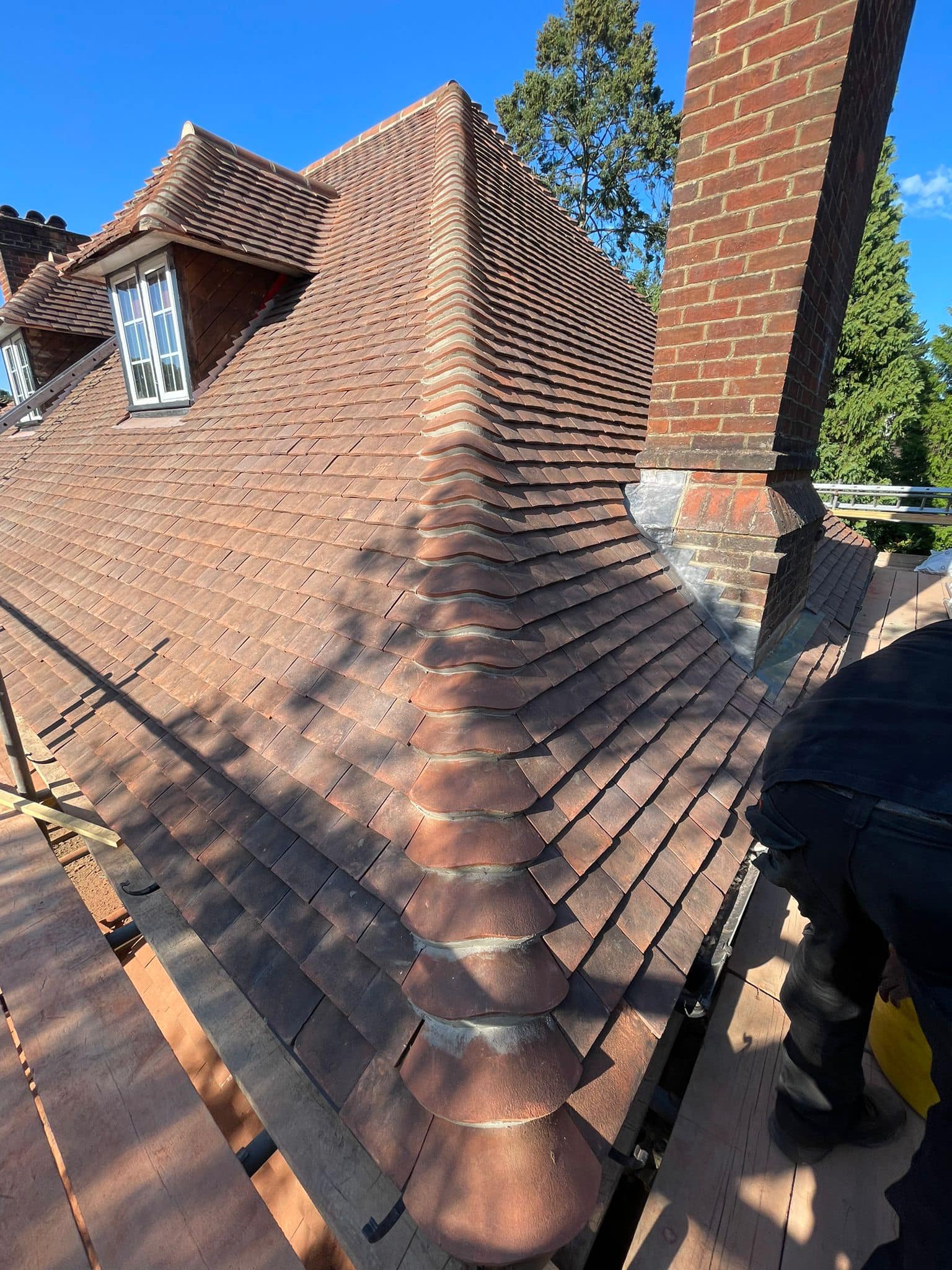Professional roofers working on a property in London - KS Roof Master