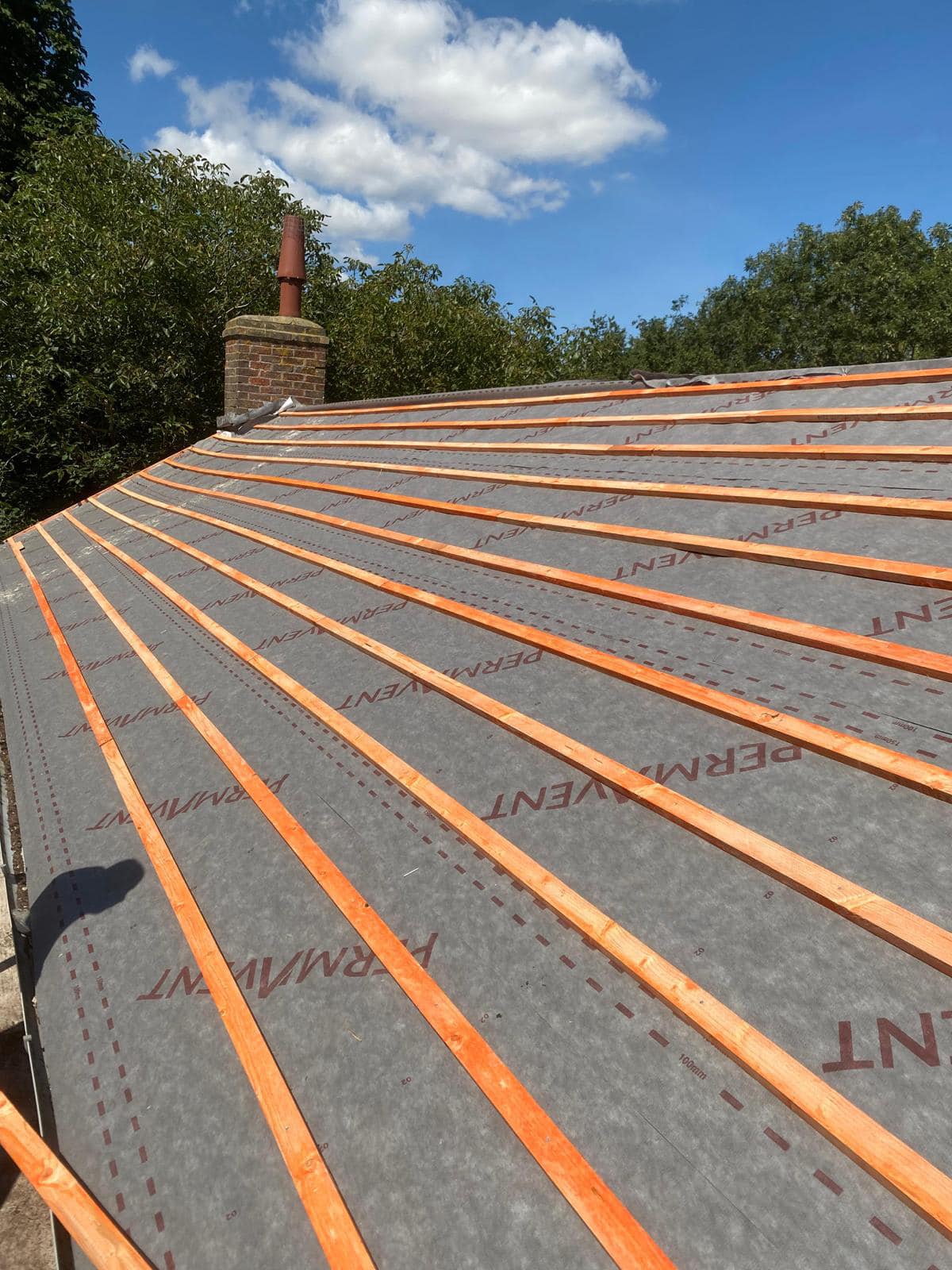 Professional roofers working on a property in London - KS Roof Master
