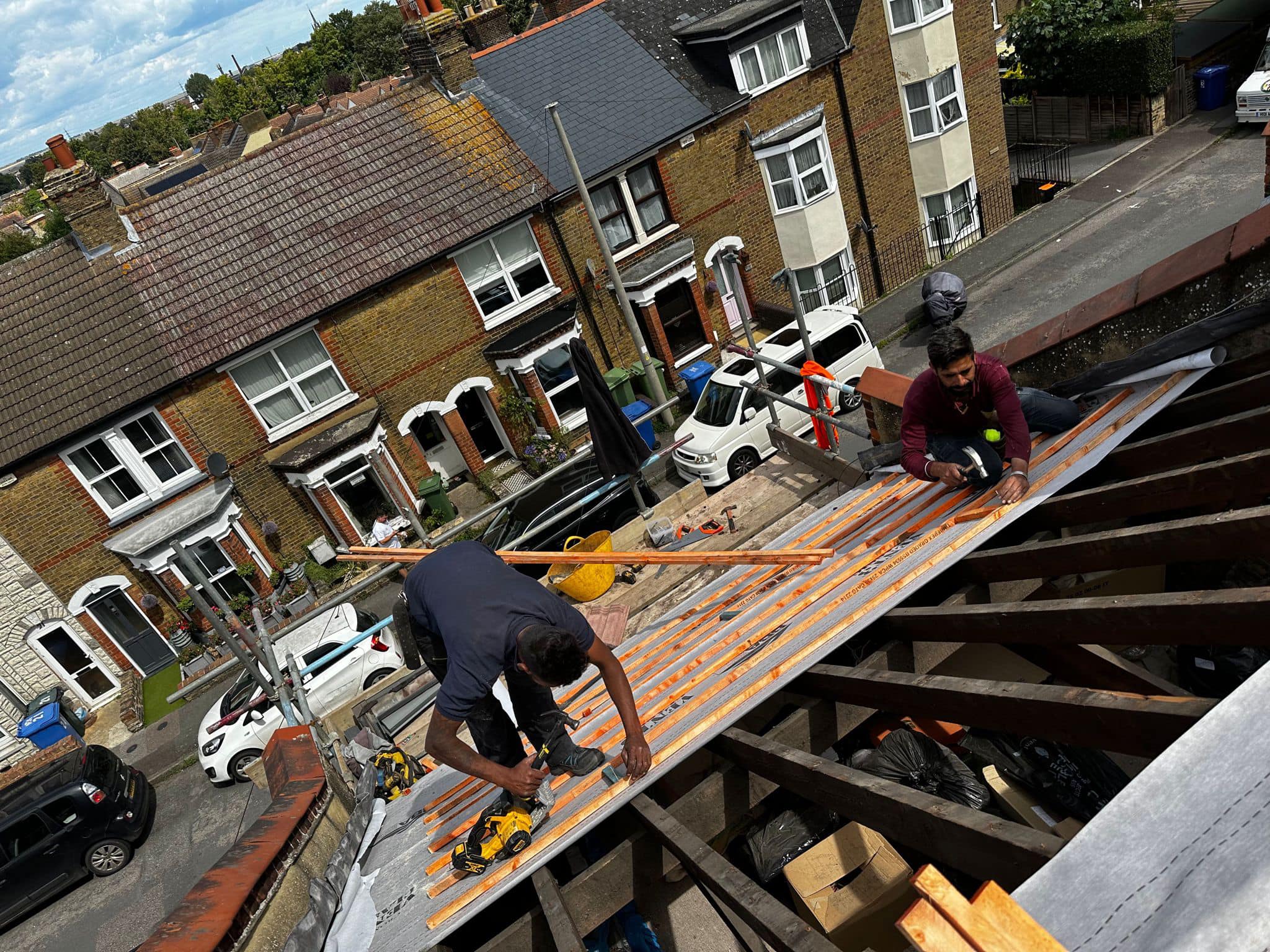 Professional roofers working on a property in London - KS Roof Master