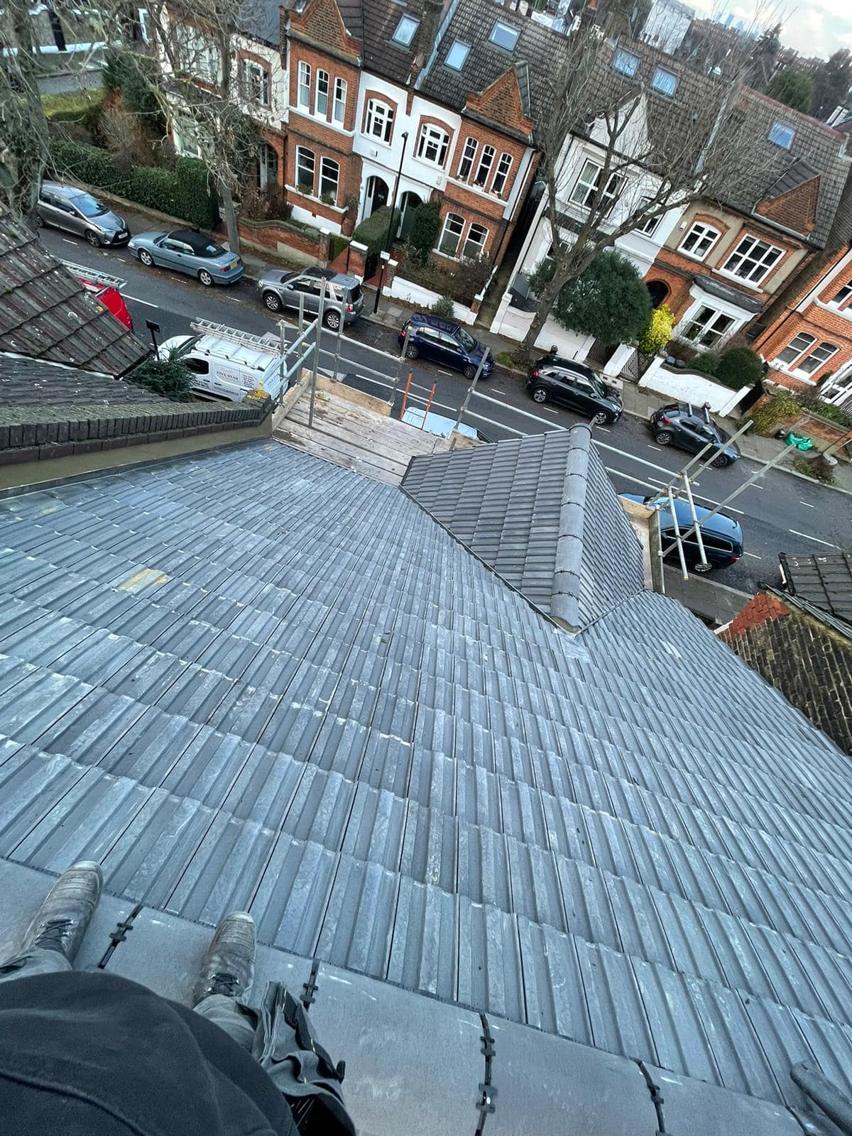 Professional roofers working on a property in London - KS Roof Master