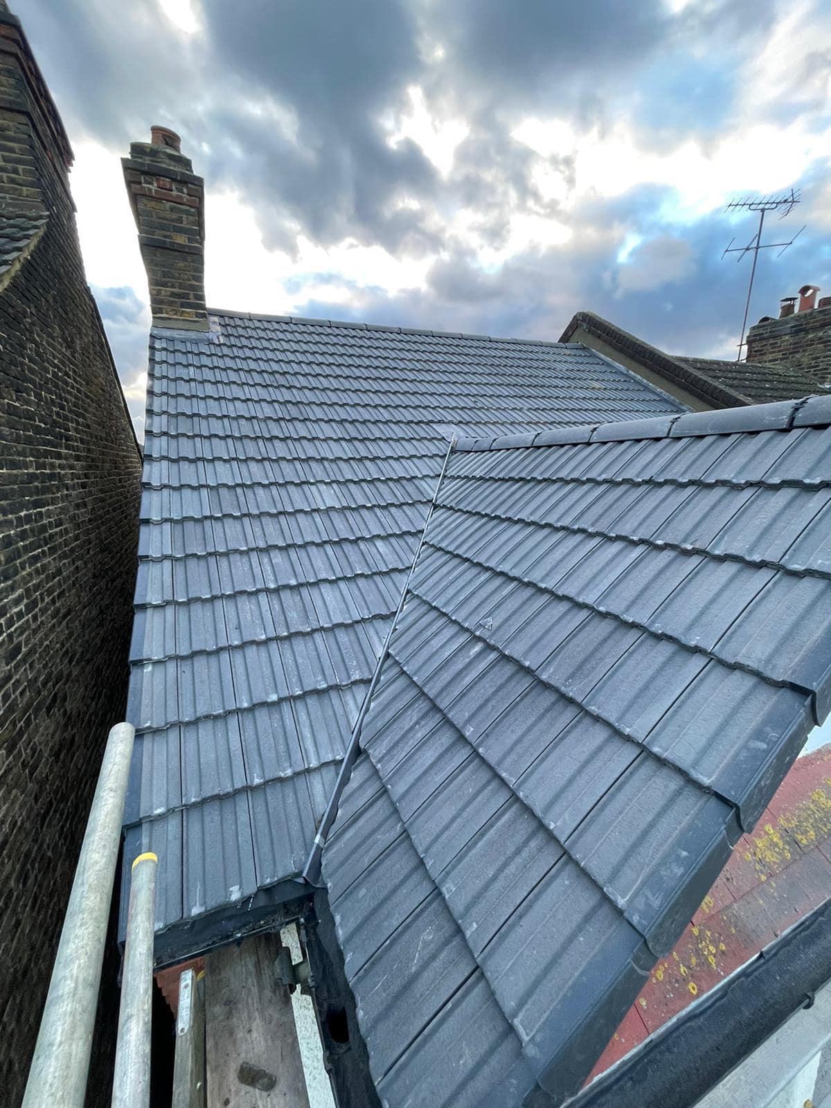 Professional roofers working on a property in London - KS Roof Master