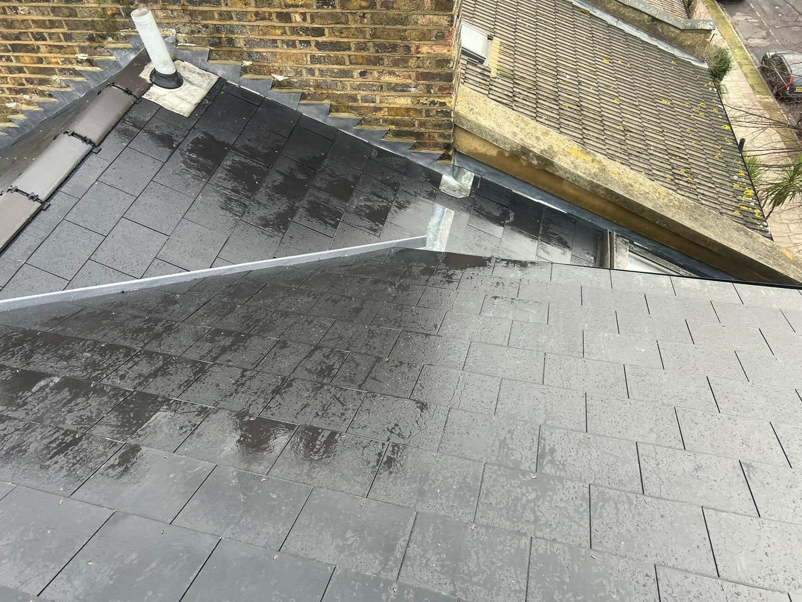 Professional roofers working on a property in London - KS Roof Master