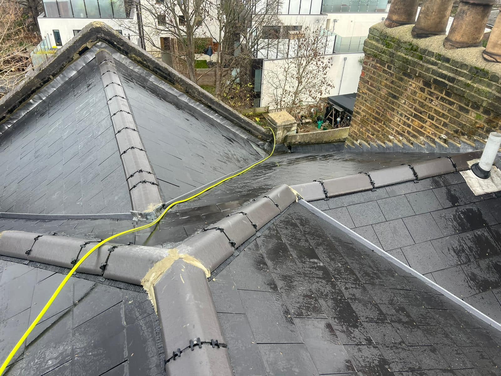 Professional roofers working on a property in London - KS Roof Master
