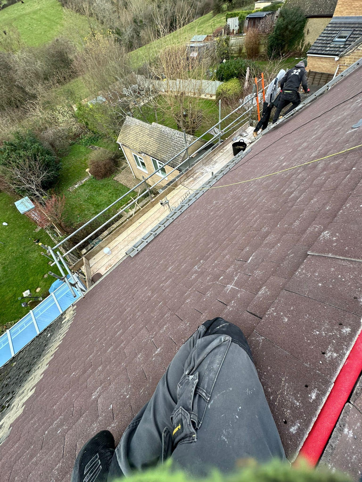 Professional roofers working on a property in London - KS Roof Master