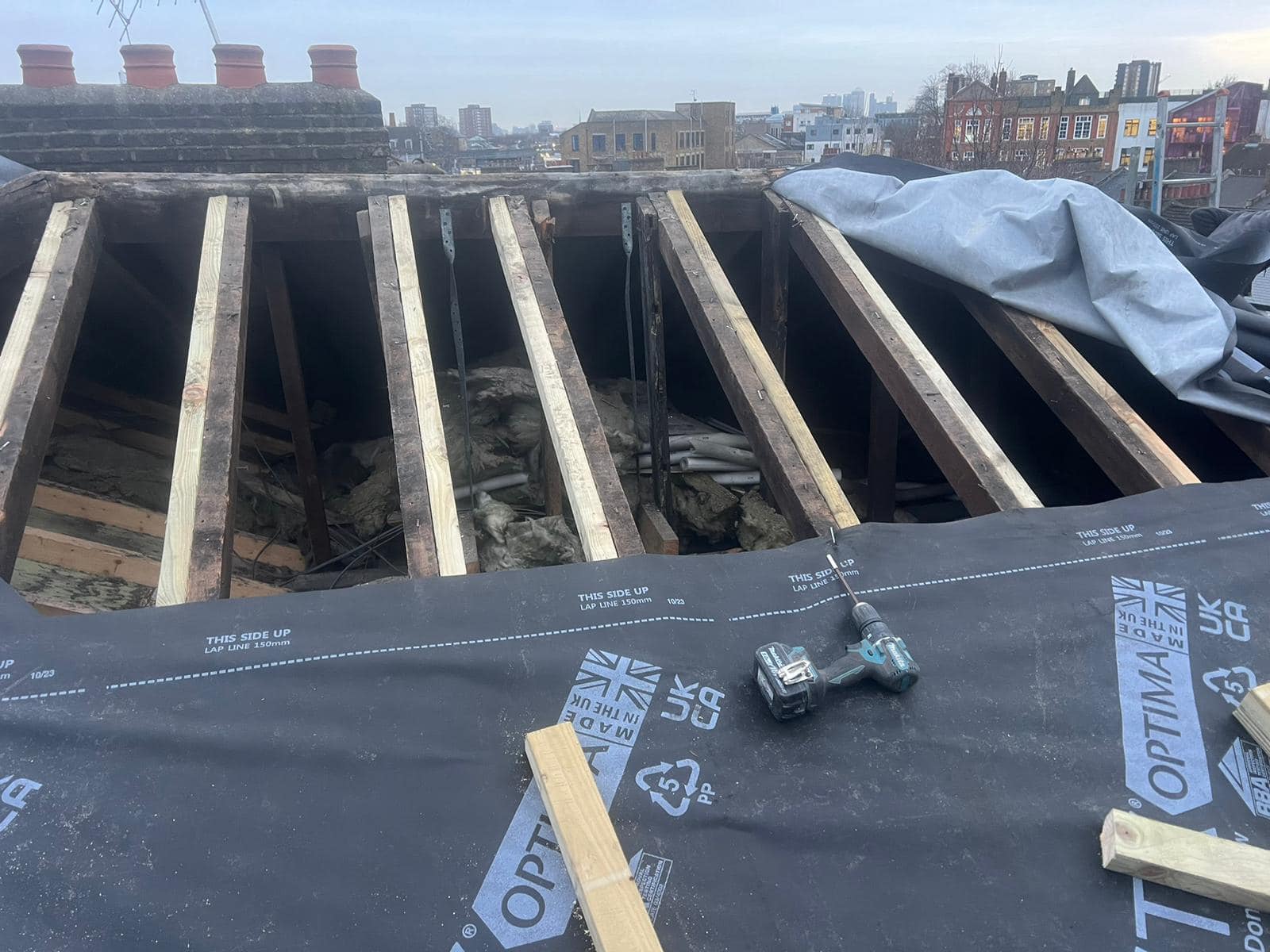Professional roofers working on a property in London - KS Roof Master