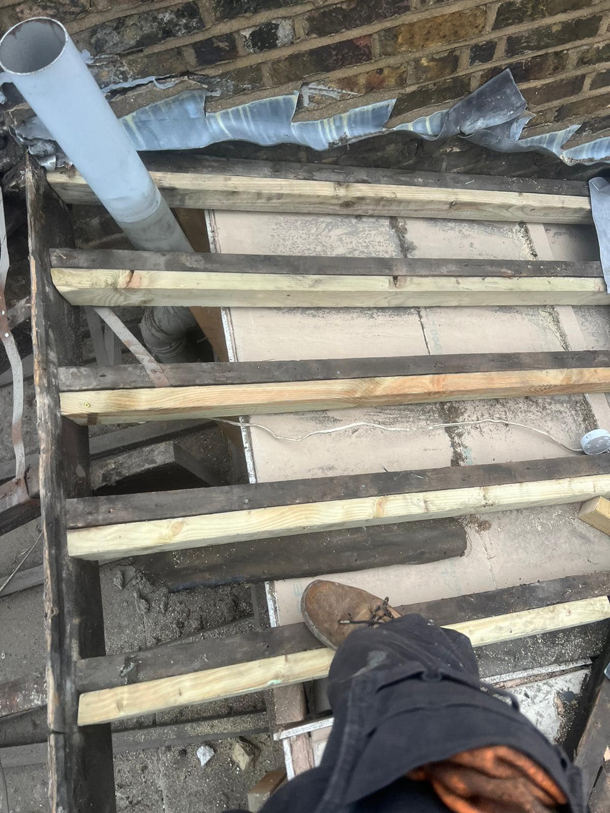 Professional roofers working on a property in London - KS Roof Master