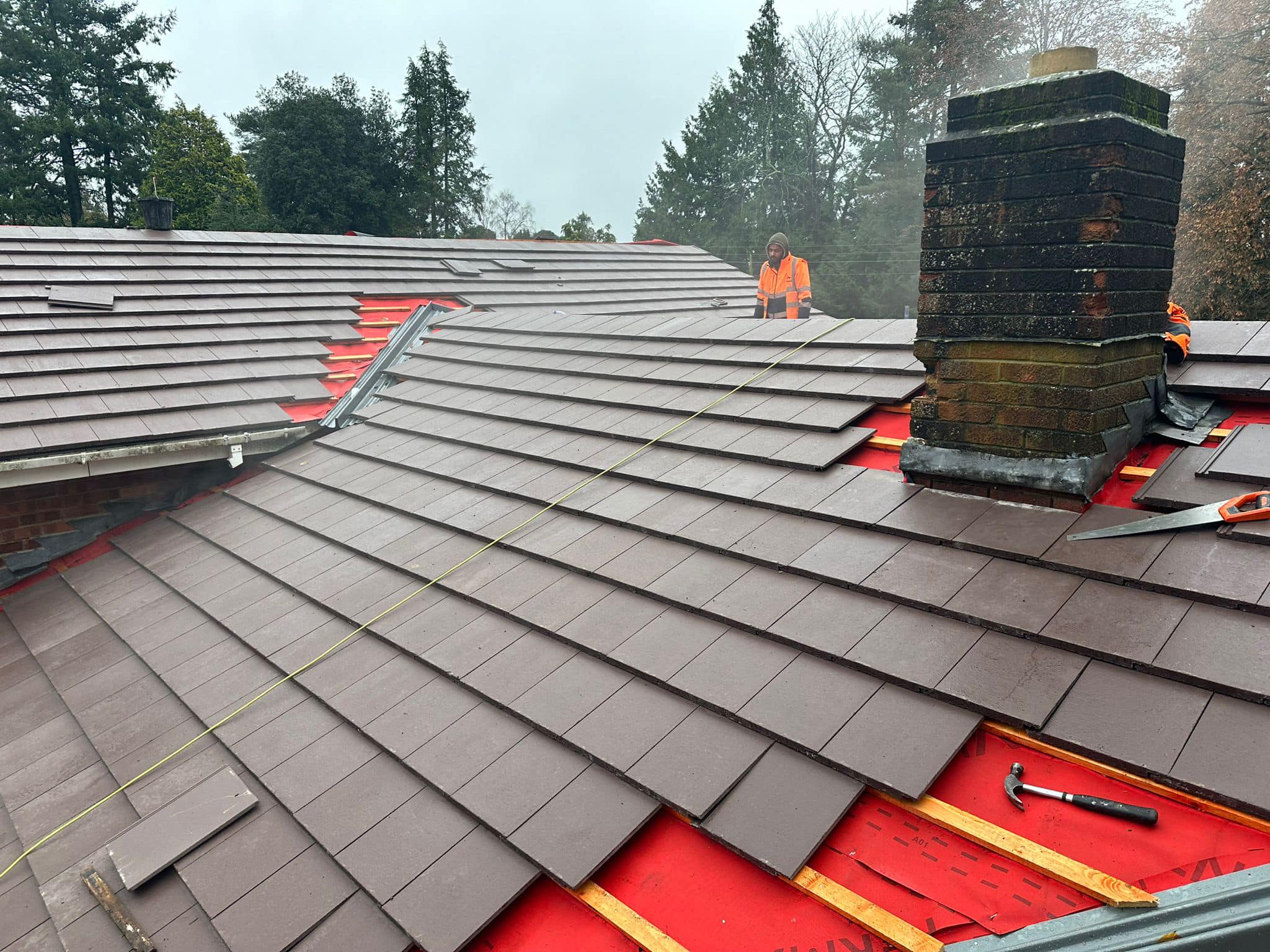 Professional roofers working on a property in London - KS Roof Master