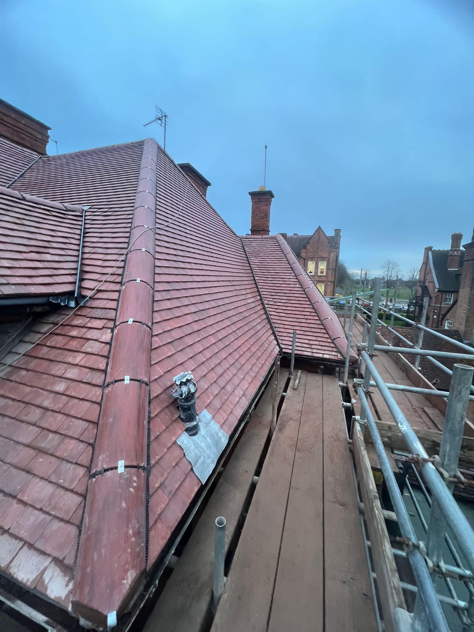 Professional roofers working on a property in London - KS Roof Master