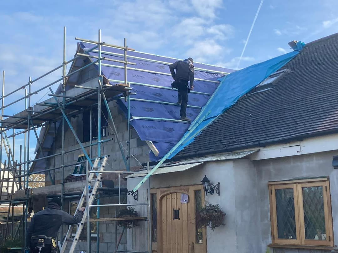 Professional roofers working on a property in London - KS Roof Master