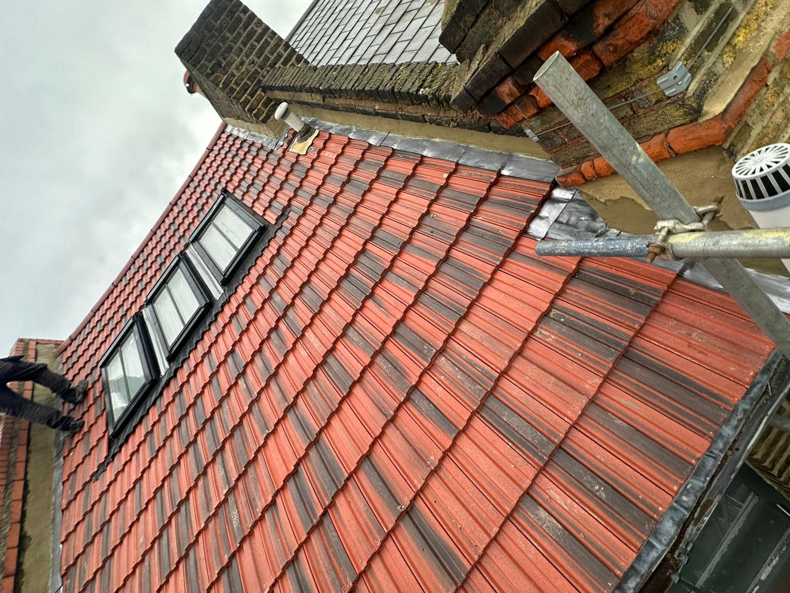 Professional roofers working on a property in London - KS Roof Master