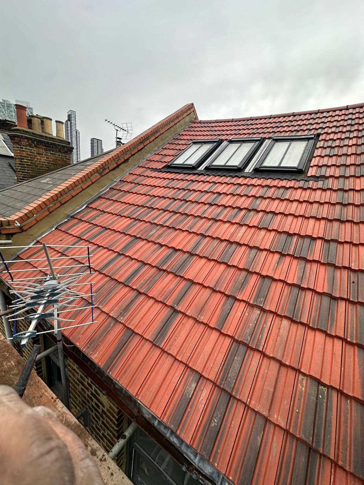 Professional roofers working on a property in London - KS Roof Master
