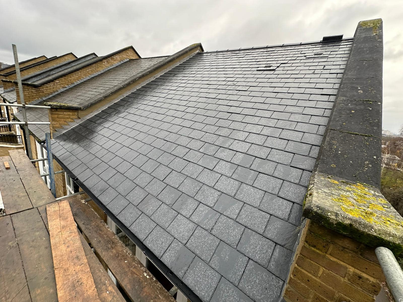 Professional roofers working on a property in London - KS Roof Master