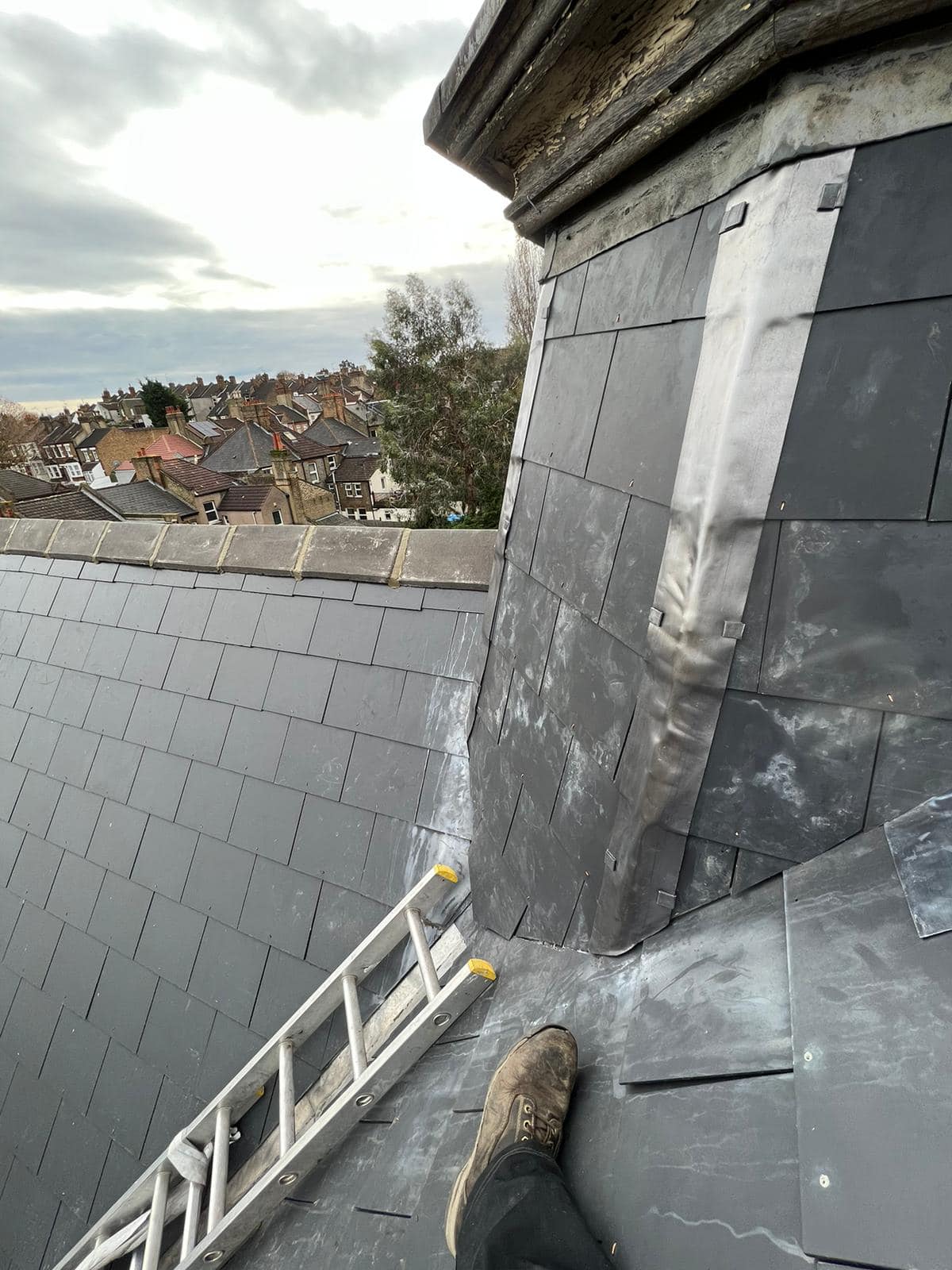 Professional roofers working on a property in London - KS Roof Master