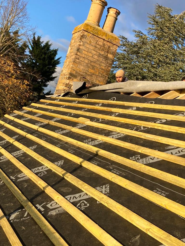 Professional roofers working on a property in London - KS Roof Master