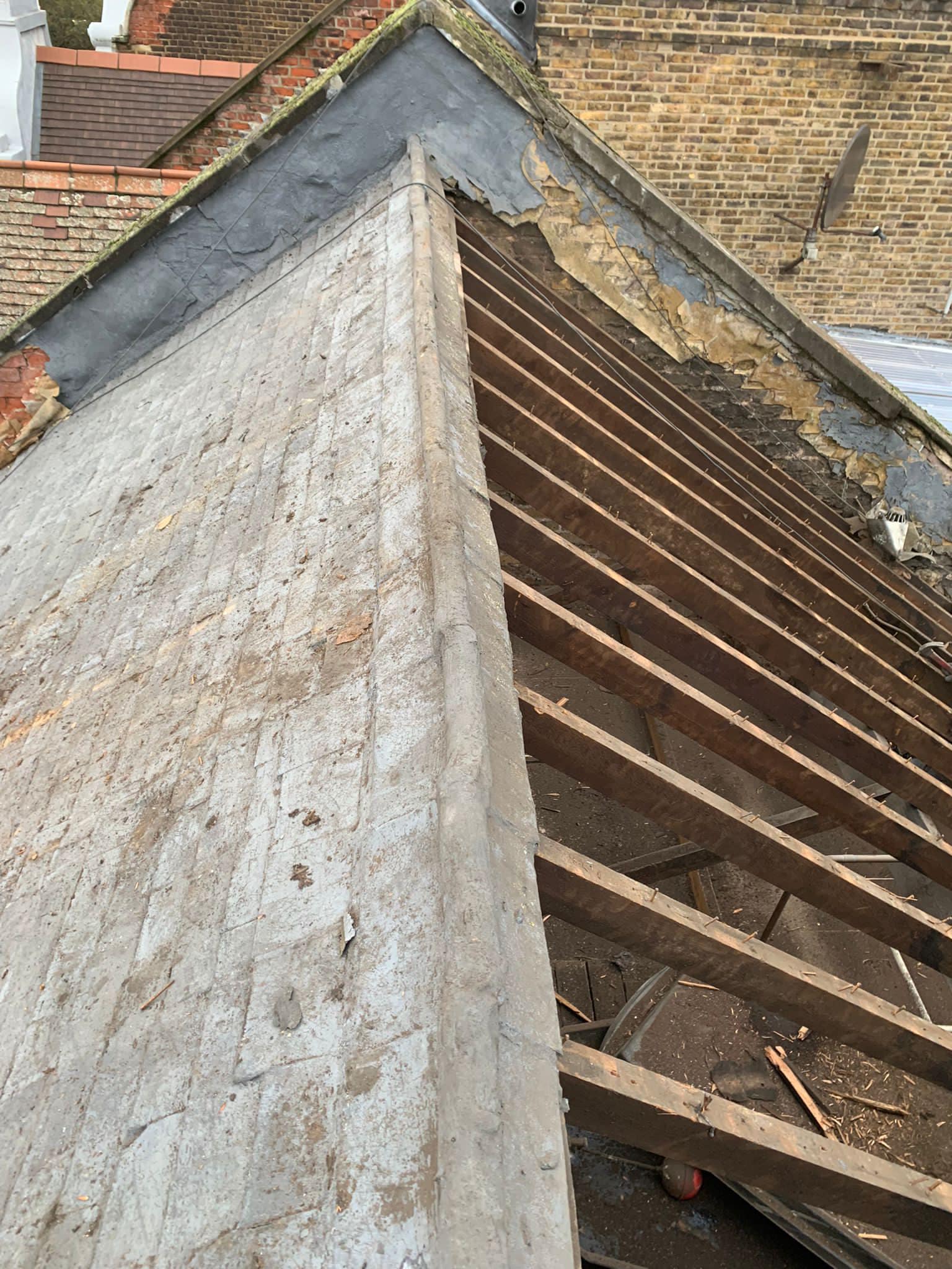 Professional roofers working on a property in London - KS Roof Master