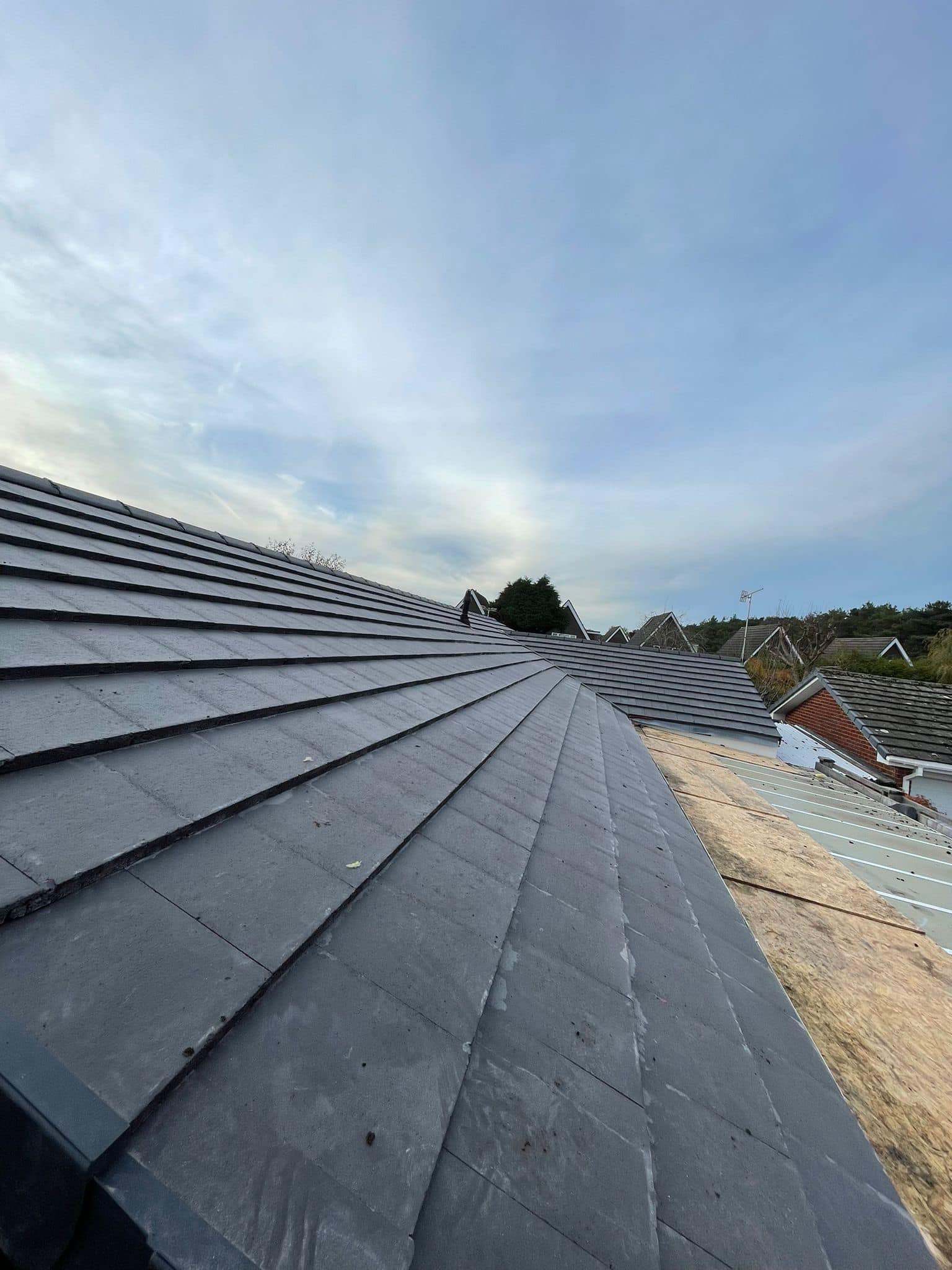 Professional roofers working on a property in London - KS Roof Master