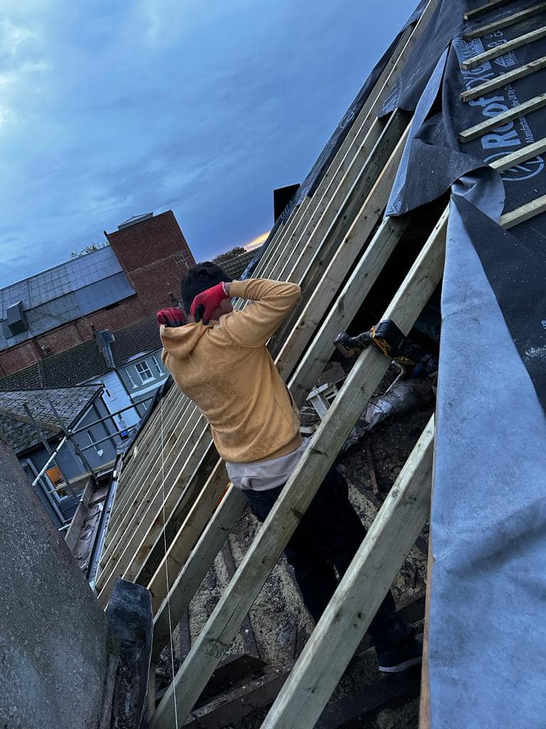Professional roofers working on a property in London - KS Roof Master