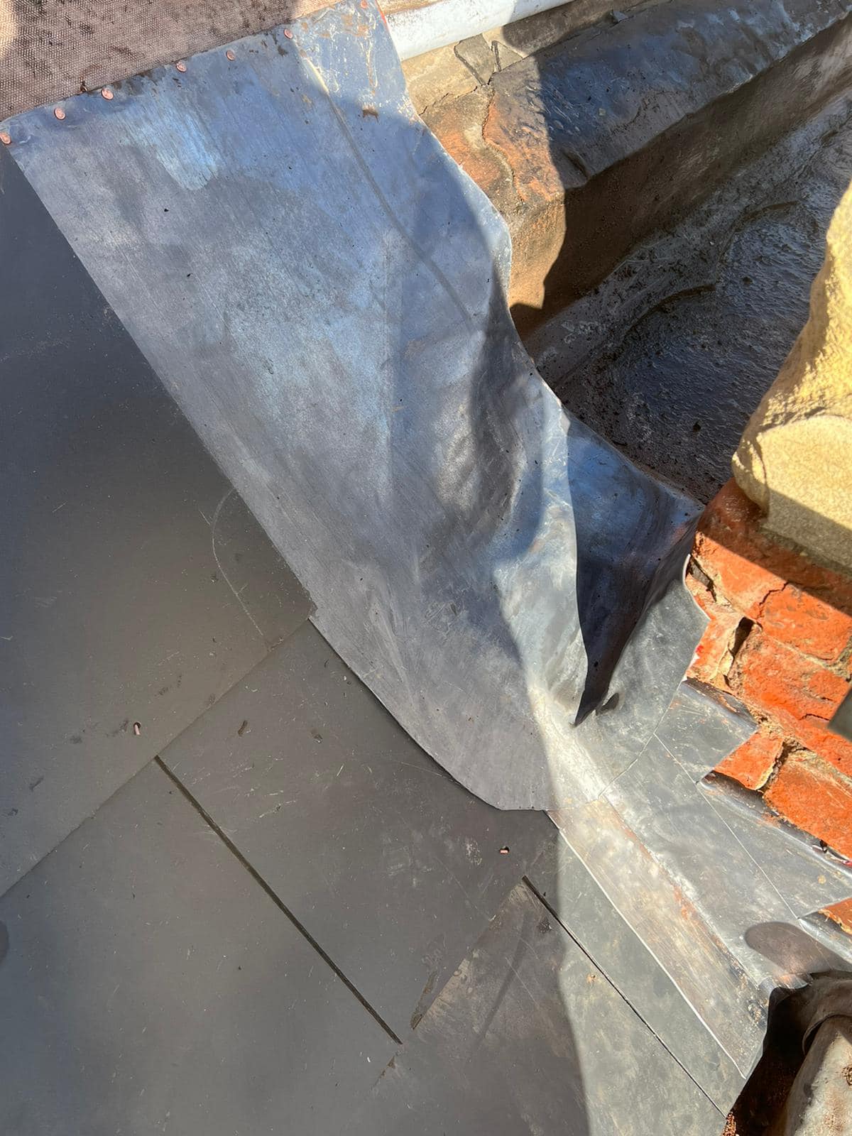 Professional roofers working on a property in London - KS Roof Master