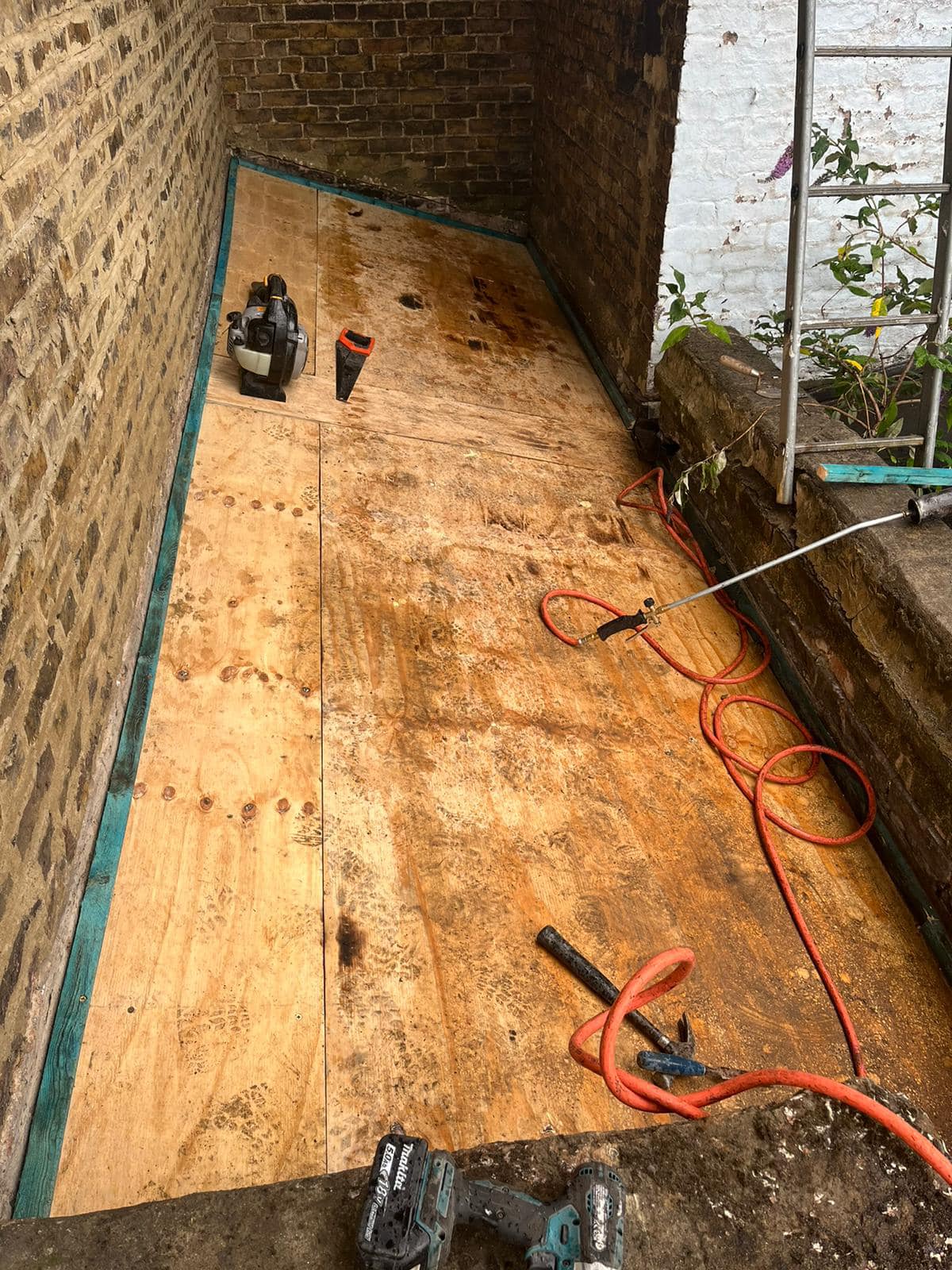 Professional roofers working on a property in London - KS Roof Master