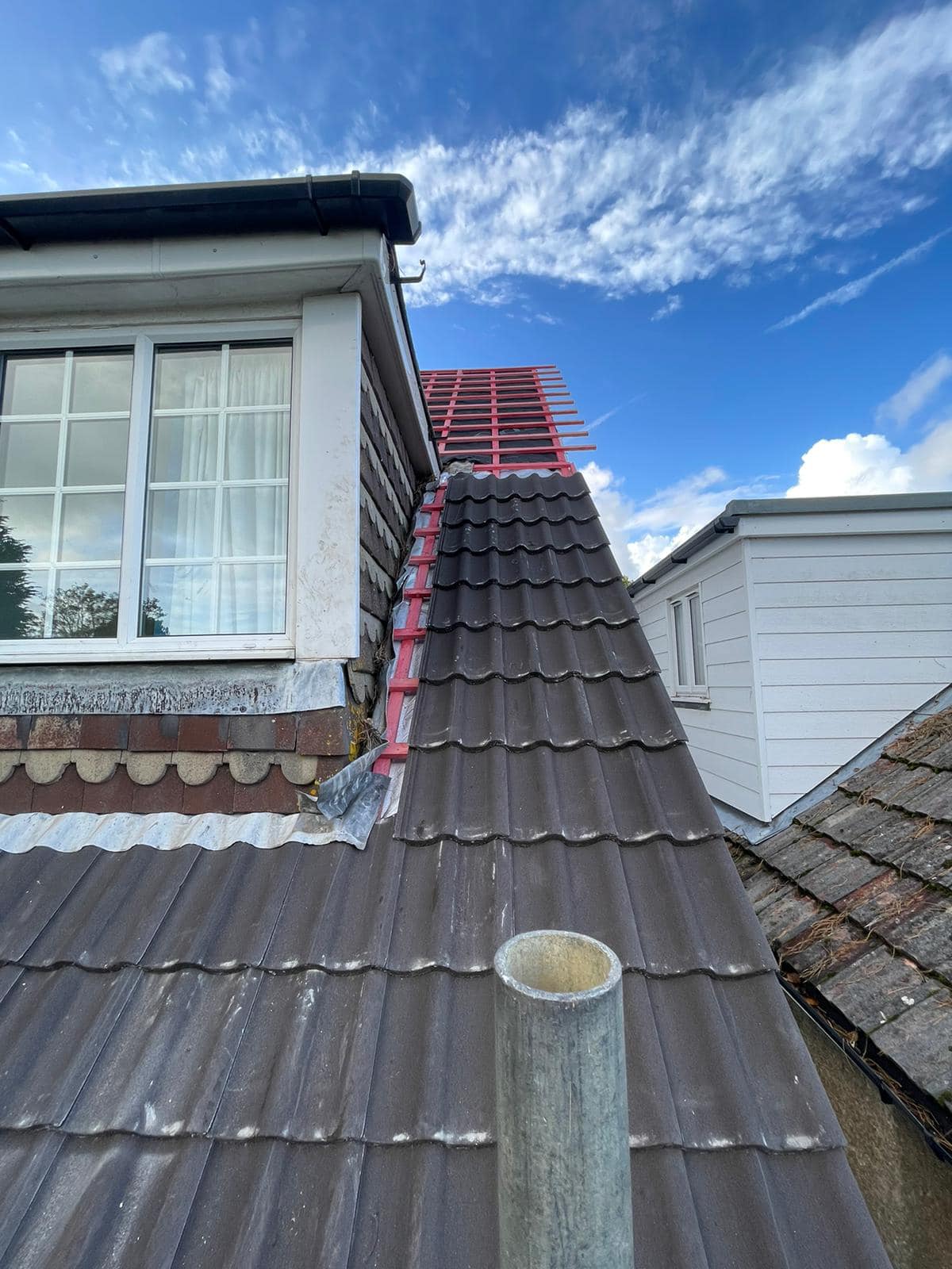 Professional roofers working on a property in London - KS Roof Master